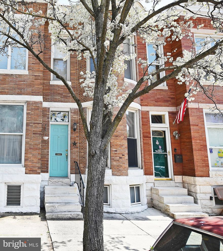 Charming 2 bedroom, 1 bathroom home located on a tree-lined street in the beautiful Riverside Park neighborhood with your very own OFF-STREET PARKING. Original hardwood floors throughout and beautiful accent wall in living room. The spacious kitchen has recently updated quartz countertops and marble backsplash. The sun-lit 2nd floor features 2 beds and 1 bath that is illuminated with natural light from skylights. Master bedroom features a walk-in closet and a unique window seat that opens up for extra storage. Basement offers a utility room  and tons of extra storage space. In the rear, you will find a covered deck with a parking pad. Great location! Close to parks, shopping, restaurants and easy access to I-95, a commuter's dream!