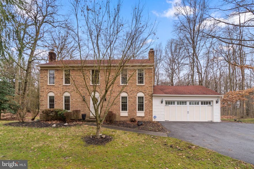 Welcome to this fantastic 4-bedroom home that seamlessly combines comfort and sophistication. The beautiful new hardwood floors welcome you into the main level, setting the tone for the elegance that awaits. Gather around the family room's fireplace for cozy evenings, or step through French doors into the all-weather sunroom off the kitchen. This sunlit retreat is framed in windows, offering picturesque views of the private backyard.

Convenience meets style with a half bath on the main level, providing practicality without compromising on design. Upstairs, discover four bedrooms, including a primary suite with an ensuite bath and a spacious closet for added luxury.

The lower level is tastefully finished, featuring a brick hearth ready for a wood or pellet stove. French doors lead to an all-brick patio, providing a seamless connection to outdoor living. An attached 2-car garage adds convenience to this delightful home.

Set on a generous 1.32-acre premium wooded lot, this property boasts a stream and backs to woods, creating a tranquil and serene atmosphere. Recent upgrades include new HVAC, Pella windows, faucets, and updated baths. Meticulously kept, this home radiates pride of ownership, with neutral paint throughout adding to its timeless appeal.

Discover the perfect blend of style and functionality in this well-maintained residence – schedule a showing today and make this home your own oasis of comfort and beauty.