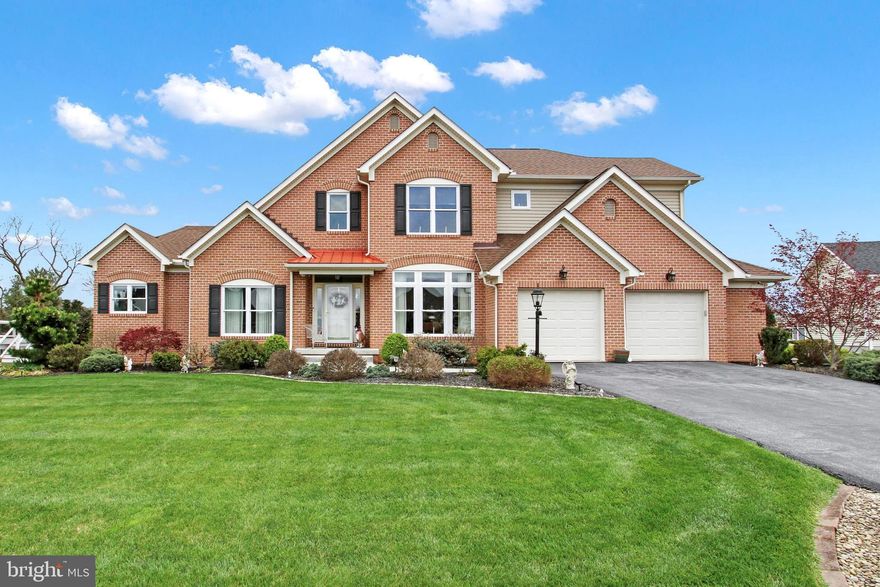 Welcome to this custom-built masterpiece boasting four bedrooms, an office, and a first-floor owner’s suite with en suite bathroom. The family room features vaulted ceilings and a custom gas-burning fireplace, creating a cozy ambiance. Entertain in style in the gourmet kitchen with granite countertops and stainless steel appliances. With three full bathrooms, one half bath, and a wrought-iron staircase, luxury meets functionality throughout. The finished basement, spanning over 1000 sq ft, offers a full bath and daylight views. Step outside to the beautiful deck made of composite material, overlooking exceptional landscaping and a brick façade exterior. This home is the epitome of comfort, style, and quality craftsmanship.