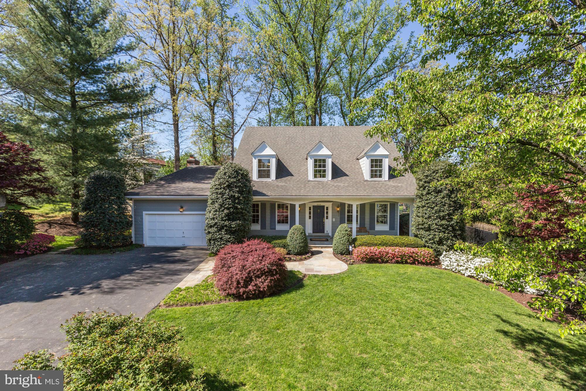OPEN SUN 5/15 2-4p Custom Williamsburg Colonial surrounded by exquisite landscaping on a private drive off Wilson Ln. Feat: chef's kitchen w/brkfst rm; vaulted ceilings; refinished wood flrs; banquet-size dining rm; cathedral ceilings in the FR w/ wet bar & FP, stunning paneled oak study; in-law stes; rec room; finished attic; an expansive deck w/garden & more! Conveniently located mins to I-495.