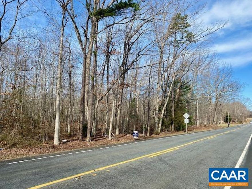 Exceptional 9.02-Acre Homesite - Route 33.  Presenting a rare opportunity to secure this magnificent 9.02-acre wooded parcel along Route 33 in Orange County, Virginia. Featuring 293 feet of prime road frontage, this thoughtfully positioned property delivers an ideal synthesis of privacy and accessibility within a pristine natural environment.  This exceptional homesite offers endless possibilities for creating your custom estate, surrounded by mature trees that provide both beauty and seclusion. The strategic location provides seamless connectivity, positioned just three miles from Route 20 South, ensuring effortless access to regional destinations while maintaining the tranquil character of countryside living.  Wine enthusiasts will appreciate the proximity to celebrated Barboursville Winery and other distinguished local attractions that define Orange County's cultural landscape. The property's generous acreage allows for diverse architectural possibilities, from intimate retreats to grand estates, all while preserving the natural integrity of this remarkable setting.  This represents an extraordinary acquisition opportunity for discerning buyers seeking to establish their legacy in one of Virginia's most coveted rural corridors.