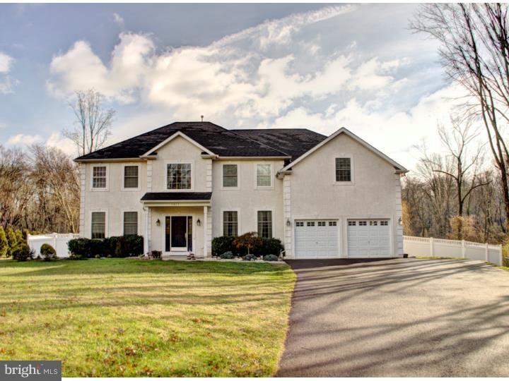 Stunning colonial on quiet street in Montgomery Township. An inviting 2-story foyer with turned oak staircase welcomes you into this home. Beautiful hardwood floors extend throughout the first floor (except in the kitchen and mudroom). The gourmet kitchen features cherry cabinetry, granite counters, ceramic tile floor and backsplash, and stainless steel appliances. A convenient mud-room is located just off of the kitchen. The 2-story family room has elegant fireplace, large windows, sliding glass doors to the rear yard, and an adjacent study with French doors and crown moulding. A dining room with trayed ceiling, a nicely appointed living room, and a full bath round out the main floor. Upstairs, the master bedroom boasts a sitting room, trayed ceiling, three walk-in closets, and a master bath with soaking tub, ceramic tile shower, and double vanity. Three other nicely sized bedrooms and a large hall bath complete the 2nd floor. Full basement, 2-car garage, and rear yard enclosed with maintenance-free privacy fencing.