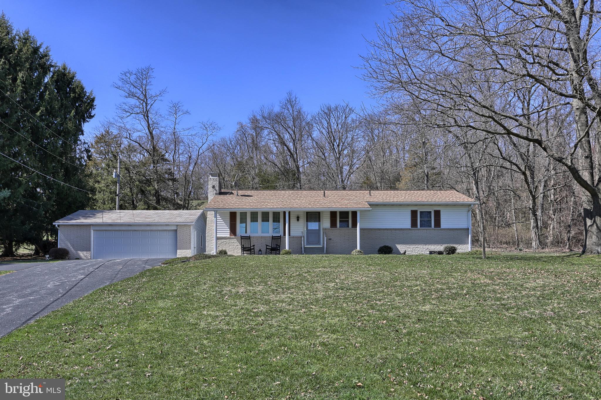 Discover the tranquil beauty of this meticulously kept home nestled within 3.52 acres of spectacular country side. This 3 bedroom, 2 fullbath home is specifically designed for those who crave an updated and current living area. You'll feel welcome once you walk up the driveway and onto the covered front porch, open the door into the home and for the first time walk into the living room. Straight ahead in the formal living room is the wood burning brick fireplace; To the left of the living room is the recently updated kitchen with peninsula and dining area. You'll find that the kitchen has plenty of cabinets and counter space to do your day to day cooking with the appliances that convey. Down the hall from the living room are 3 bedrooms and main bathroom. Let s not forget about the expansive lower level which has a family room with another brick wood burning fireplace and laundry room w/2nd full bath. The detached oversize 2 car garage and the lower level utility room have plenty of space for storage and both have a workshop area. There is plenty of parking for that car enthusiast as well. One can relax on the covered deck entertaining and welcoming your guests to this fabulous home. Other property features include, updated laminate flooring, new water proofing system and Belco door. Conveniently located just off of Pinchot Park. Don t miss out in seeing this terrific home and property.