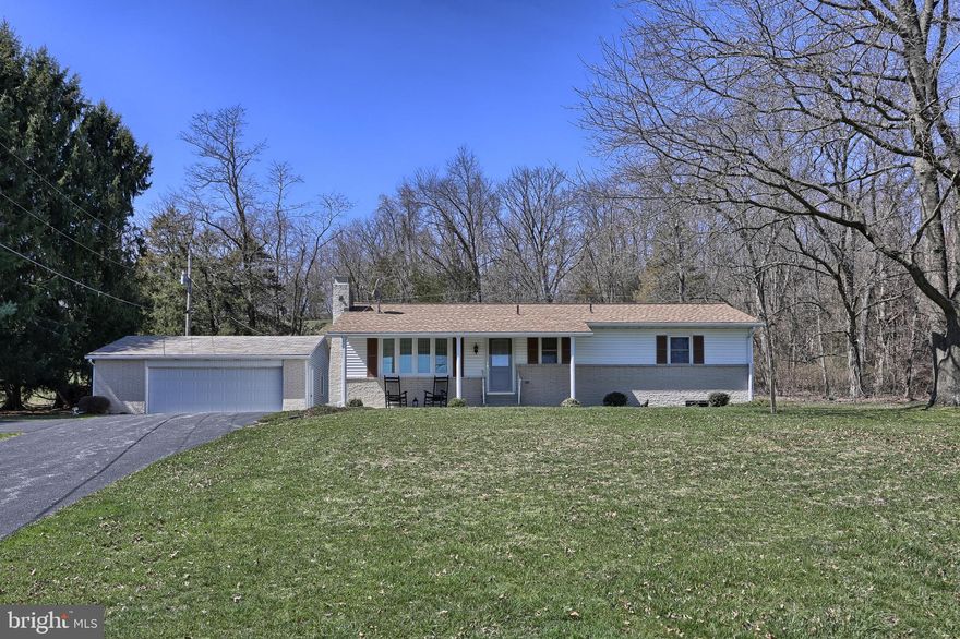 Discover the tranquil beauty of this meticulously kept home nestled within 3.52 acres of spectacular country side. This 3 bedroom, 2 fullbath home is specifically designed for those who crave an updated and current living area. You'll feel welcome once you walk up the driveway and onto the covered front porch, open the door into the home and for the first time walk into the living room.  Straight ahead in the formal living room is the wood burning brick fireplace; To the left of the living room is the recently updated kitchen with peninsula and dining area. You'll find that the kitchen has plenty of cabinets and counter space to do your day to day cooking with the appliances that convey. Down the hall from the living room are 3 bedrooms and main bathroom. Let s not forget about the expansive lower level which has a family room with another brick wood burning fireplace and laundry room w/2nd full bath. The detached oversize 2 car garage and the lower level utility room have plenty of space for storage and both have a workshop area.  There is plenty of parking for that car enthusiast as well.  One can relax on the covered deck entertaining and welcoming your guests to this fabulous home. Other property features include, updated laminate flooring, new water proofing system and Belco door.  Conveniently located just off of Pinchot Park.  Don t miss out in seeing this terrific home and property.