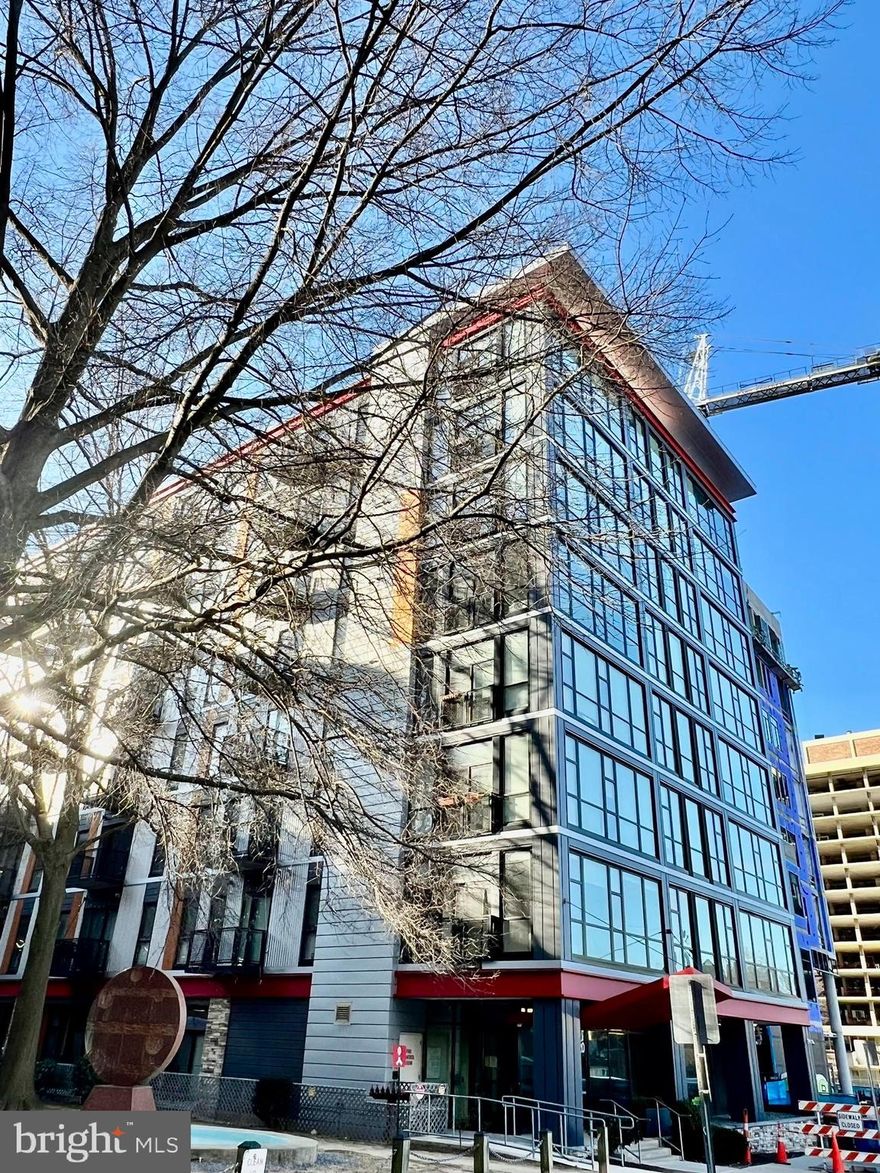 Enjoy all the convenience of city living in this gorgeous penthouse 2 bedroom, 2 full bath condo loaded with upgrades and perfectly located in the heart of downtown Silver Spring,  only a few blocks away from Metro and the area's finest restaurants, shopping, entertainment and nightlife. 
The whole building was renovated in 2016. An upscale lobby with secured entrance, rooftop deck, private balcony, panoramic views, high ceilings, updated LVP floors & carpets, an abundance of floor to ceiling windows, on trend neutral paint, and full size washer and dryer in unit create instant move-in appeal.
Updated LVP floors welcome you home and usher you into the spacious main living area featuring warm neutral paint, contemporary ceiling fans and lighting, and a wall of windows delivering bird's eye views of the cityscape beyond. Sliding glass doors open to a cozy balcony, perfect for morning coffee or relaxing at the end of the day. The dining area/breakfast bar introduces the sparkling kitchen that is sure to please with pristine custom 42 inch cabinetry, quartz countertops, designer tile backsplash, sleek lighting, and stainless steel appliances including built-in microwave and gas range. The master bedroom boasts a wall of windows, walk-in closet, and private upgraded full bath with glass enclosed step-in shower. A 2nd bright and cheerful bedroom with walk in closet shares access to the similarly fashioned hall bath with tub/shower combo, while a full size washer and dryer, and extra storage add convenience.
All this located in luxurious Octave, a pet-friendly and secure building with concierge, upscale lobby, club room, fitness center, bike storage, amazing sky lounge with fireplace, and spectacular rooftop deck. Walk to Silver Spring Metro, and just steps away from plenty of diverse shopping, dining, parks, and entertainment choices in every direction, including the Fillmore! If you're looking for an exceptional home in a vibrant location, this is it!