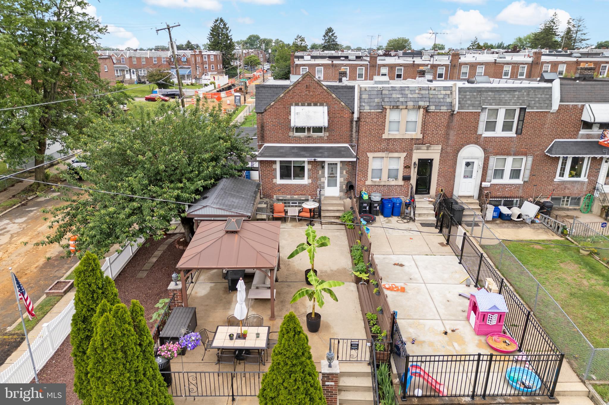 BIG Price Reduction! Have you ever dreamt of owning the home that everyone else talks about and wants to spend time at? If you have, this may be your opportunity to make that dream come true! This home stands out, possibly more than any other home in Mayfair! If you loves to host family/friend get togethers, or would just love the thought of sipping your favorite drink and having dinner on your patio, while watching your favorite team outside on a beautiful evening, this could be a great fit for you! If you are having a hard time finding space for a personal gym, a sauna, an entertainment room, or some other type of versatile space, this could be a great fit for you! Welcome to this Corner home in desirable West Mayfair, just a short walk to Pennypack Park, Schools, Public Transportation, the Frankford Avenue shopping district, and a short drive to Route 1, I95, and practically anywhere you want to go! What really sets this NE Philly Oasis apart from the rest of the homes you can choose from, are the exterior features that offer you so many options. There are two detached garages, the aforementioned versatile outbuilding which has it's own 220amp electric service, the front cement patio, with the outdoor Kitchen. The shade tree and white picket fenced side yard, perfect for your seasonal & holiday décor. When you're ready to go inside, you can enter the main front Living room entrance, where you'll appreciate the neutral gray colors of the walls and wood flooring, the crown molding, and the openness of the Dining room & full Kitchen, complete with abundant counter-top space, cabinetry, built-in stainless steel microwave, dishwasher, wine-chiller, three door refrigerator, double steel sink, and a gas range/oven. The upper level accommodates with a spacious Owner's Bedroom with ceiling fan and mirrored sliding door closet, a 3pc hallway Bathroom with skylight and tub/shower combo, and two more complimentary Bedrooms, each with a ceiling fan. Oh, and let's not forget the Anderson, double pane with high UV rating, windows (2023). The finished lower level is an entire living space of it's own! From it's rear ground floor entrance, an open floor plan, wood flooring, bar style seating, recessed lighting, a 4th Bedroom, fire place, mirrored Laundry closets, and a well appointed full Bathroom! This home has so much to offer, including Central Air & Heat, so be sure to take a minute to view the video tour, and then schedule your in-person showing appointment, today! Sorry, no FHA or VA offers.