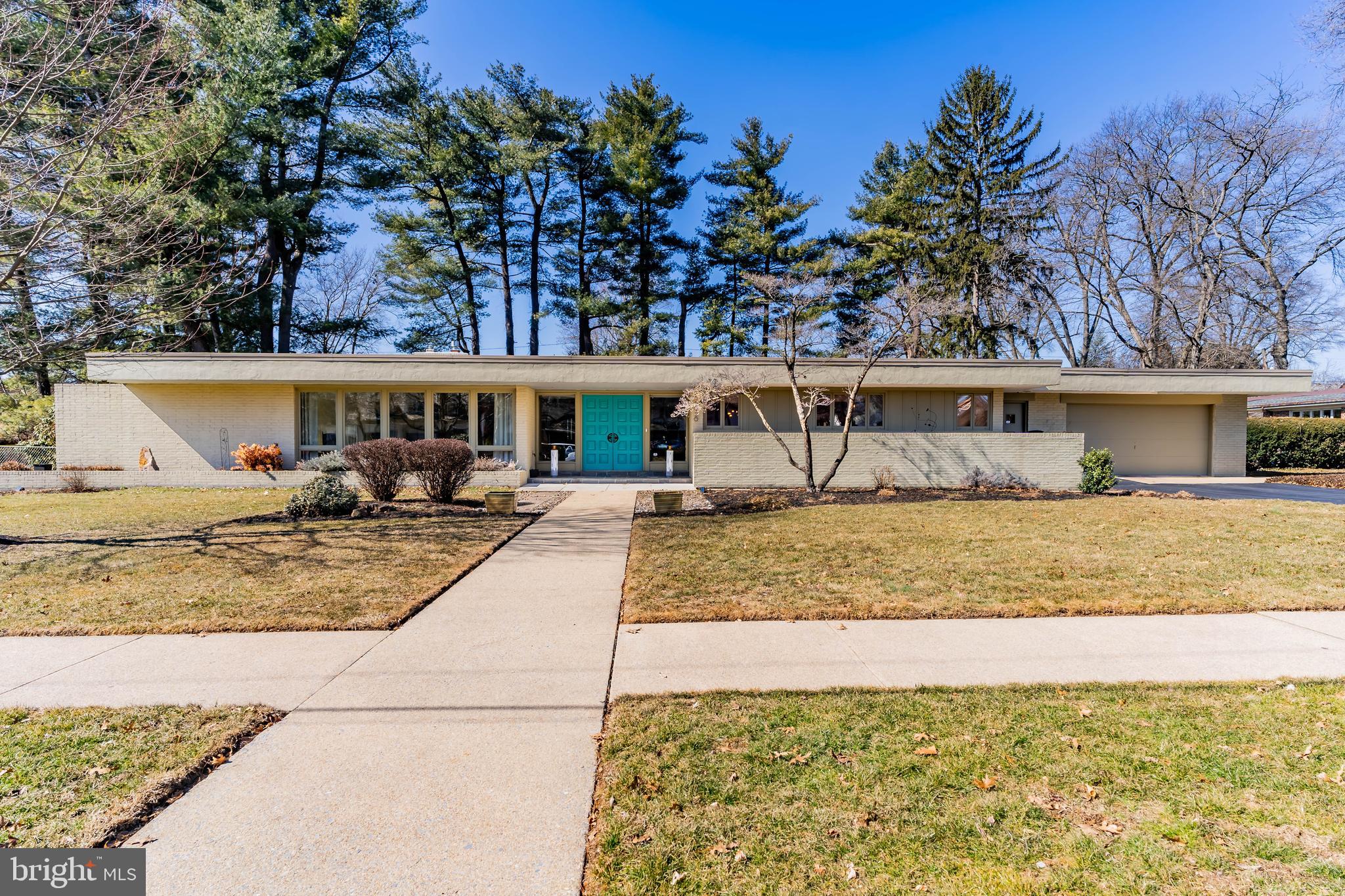 Sprawling Mid Century Modern Split Level, circa 1963, in sought after location. This dream of a home offers over 5,000 square feet of impeccably maintained living space. Double doors open to a grand skylit entry with natural slate floor. The spacious and bright living room with walls of East and South facing windows is awash with natural light and also has lots of recessed lights and a chic gas fireplace. Pocket doors open to a handsome library with floor to ceiling built ins, a beamed ceiling, a stone gas fireplace and wet bar. The fully equipped kitchen offers both gas and induction cook tops, and stainless steel appliances including a wall oven, convection microwave, warming oven, espresso machine, wine refrigerator, and a subzero refrigerator. Abundant wood cabinetry, tiled backsplash, cork floor and banquette are all in keeping with the 1960's. The large dining room with a cork floor and sliding doors to a private, partly covered patio also has a unique moveable wall to provide an opportunity to create a smaller space for more intimate gatherings. A utility room with laundry, utility sink, second refrigerator and an additional half bath also provides a convenient access to outside and to the 2-car garage. The skylit stairway ascends to a large landing with a walk-in cedar closet and the sleeping level which includes 3 bedrooms and 3 full baths. The luxurious primary suite features 2 large walk-in closets, each with custom built-ins and a lovely renovated en-suite bath with tiled shower and tub and double sinks. The finished lower level offers over 1300 square feet of living space which includes a 4th bedroom and full bath, a family room with a wood burning fireplace, an office/library with built-ins and a media room with 8 plush reclining chairs! The serene, and partly fenced back yard is bordered by majestic evergreens and has a delightful area for quiet relaxation. Conveniently located to Italian Lake, Riverfront Park, the Capitol Green Belt, highway and downtown, this exceptional home was built on a triple lot (one tax parcel) and was built to industrial standards of the day and boasts a 1" water line, 2 five-ton HVAC units with efficient perimeter diffuser forced air heat, programmable thermostats, myQ monitoring, security system, ring cameras and much more. Home Warranty. Come see this Mid Century Masterpiece and prepare to fall in love!