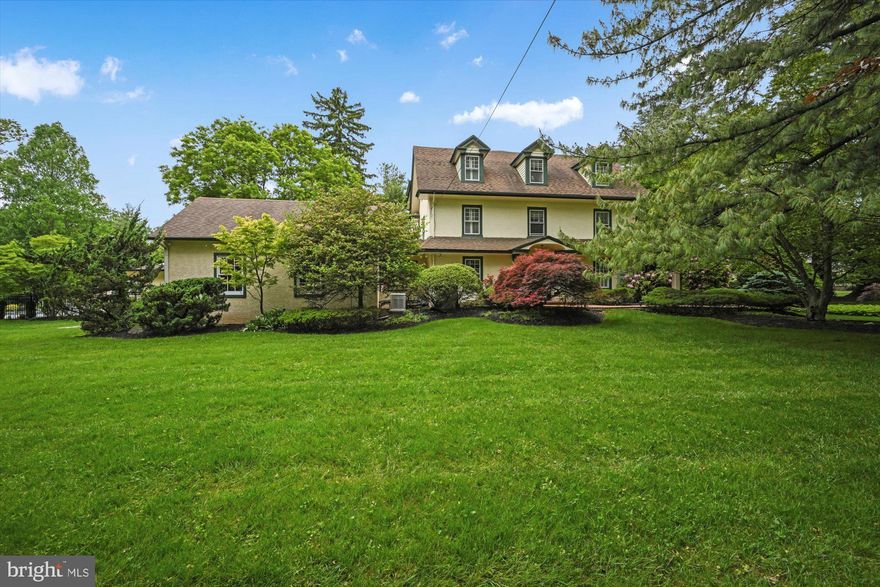 Welcome to 932 Hagys Ford Rd, one of the original properties in tranquil Penn Valley and a tasteful blend of the old and new.  One of the largest lots in the neighborhood, it features a combination of mature foliage and newer specimen plantings to create a bucolic space for private living and indoor/outdoor entertaining.  Nature envelopes the house, pool, and pool house to give the backyard the feeling of an arboretum.
The driveway affords plenty of off-street parking for holiday parties and summer barbeques.  A recently refinished, spacious garage shelters two cars and boasts a room above that has been used at different times for home office, kids playroom, exercise, and gaming room.
The first floor welcomes with custom Arizona tile and new hardwood floors.  This floor and its bar/kitchen area was expertly renovated by Gardner Fox in 2016.  The long row of windows allows afternoon sunlight to highlight the hand-painted mural art by a local Philadelphia area artist.  The back door opens onto a quartzite patio and you are in the middle of nature.  A newly renovated pool house offers a pavilion for hosting outdoor events such as pool parties and barbeques during the summer season.  The electric heat and fireplace make it a comfortable guesthouse and man cave/she shed during the off-season.  The pool house windows and sliding door open onto a beautifully renovated pool deck and pool, the perfect place for summer fun.
The kitchen boasts premium omega and black galaxy granites, custom cabinets, and Thermador appliances.  Off the kitchen, the powder room includes a marble floor, exquisite wall tile, artisanal sink, and vanity custom-made with wood salvaged from historic Brewery Town Philadelphia.  A charming dining room and sitting room include custom embroidered window treatments by Sheffields, historic fireplaces, and another gorgeous hand-painted mural.  Upstairs, the two sleeping floors offer six bedrooms and three full baths.  Two bedrooms are configured as primary suites and the smaller one was used most recently as an office with built-in shelving.  Large windows offer views of the backyard and pool deck, while mostly obstructing street view, making this a very private estate.
This special home has been lovingly maintained and invested in by its current and prior owners with significant investments, both indoors and out, over the last 30 years.