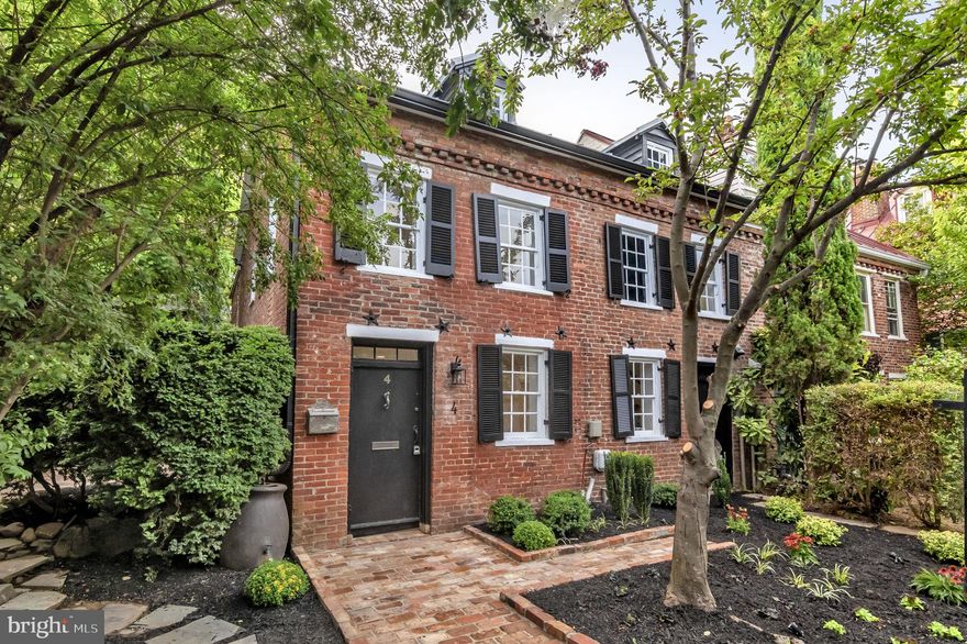 Welcome to your dream home in the heart of Historic Old Town Alexandria! JUST confirmed with the HISTORIC ALEXANDRIA FOUNDATION that this home is receiving it's historical plague!! with the Nestled just a few blocks away from the majestic Potomac River, this timeless residence offers a blend of historic charm and modern luxury. Experience the convenience of city living with schools, parks, renowned restaurants, and shopping all within a stone's throw. The exterior of this enchanting abode showcases the rich history of the area, boasting original brickwork dating back to 1790 when the home was first built. As you step into the meticulously landscaped outdoor seating area, you'll be greeted by a haven of relaxation featuring flagstone pathways, elegant lighting, mature trees, and an oasis of privacy. The interior has been thoughtfully and fully remodeled, ensuring that every corner exudes comfort and sophistication. The heart of the home is the chef's kitchen, adorned with top-of-the-line Bosch appliances that promise culinary excellence. Quartz countertops, a wine bar, a sprawling center island, and the subtle glow of under-cabinet lighting create an atmosphere perfect for entertaining or daily indulgence. Hardwood floors span the space, enhancing the warm ambiance, while generous ceiling heights throughout the entire home provide an open and airy feel. The upper level hosts three bedrooms, two full baths, and a conveniently located laundry area. The master suite stands as a testament to bespoke design, featuring a custom accent wall, an exquisite luxury master bath, and an abundance of invigorating natural light. This remarkable residence captures the essence of Old Town Alexandria's historic allure while offering all the modern amenities discerning homeowners desire. Immerse yourself in a lifestyle where the past seamlessly meets the present, creating a space that you'll be proud to call home. Don't miss the opportunity to experience this captivating property firsthand—schedule a viewing today and step into a world of timeless elegance and contemporary comfort.