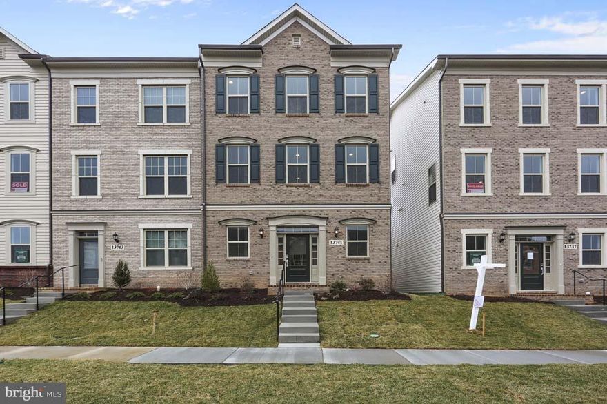 This is our largest 3 level townhome in the community. It has beautiful hardwood flooring on lower level as well as kitchen level and stairs. Kitchen has Flagstone Cabinets and Bianco Romano Granite. The current promotion on this move in ready home is a FREE 20x10 foot deck! 10K in closing costs as well and price reflects 7K in free options.