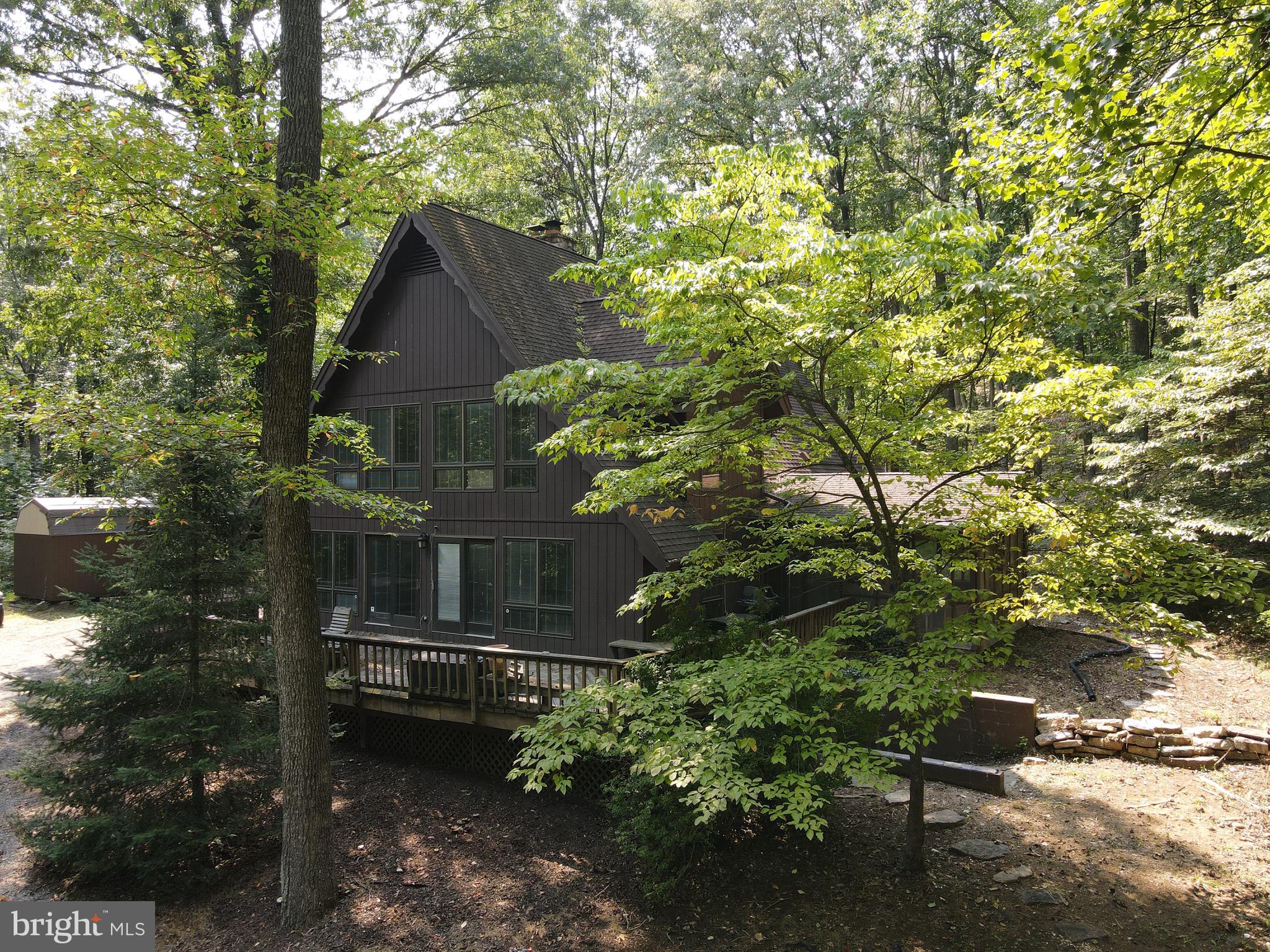 Remarkable rental property with nearly 34 acres of privacy. Home features 4 bedrooms, 3 full baths, a three car garage, and a large screened in porch. Lots of natural light, tons of wildlife, stone fireplace, gas stove/range, and much more. Bedrooms are of large size with plenty of closet space. The home is just minutes from town but very quiet and private. Land features some rock formations, trails, and a freshly manicured driveway. A full basement can be made into additional living space and a garage door also.