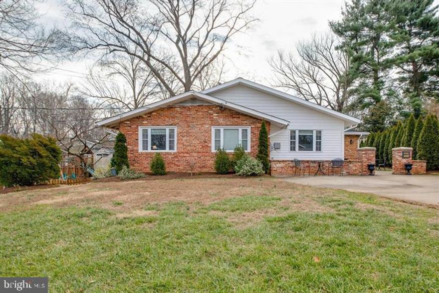 Beautifully expanded 4 BR, 3 Full Bath home with Master in-suite, large addition- family room, 2 fireplace, renovated gourmet kitchen with / stainless steel appliances, granite, island & pantry, Hardwood floors. main level approx. 2100 sq & basement with 1300 sq fully finished walk-out with full bath. EZ access to 50/123/29/495/66, GMU, bus to metro.