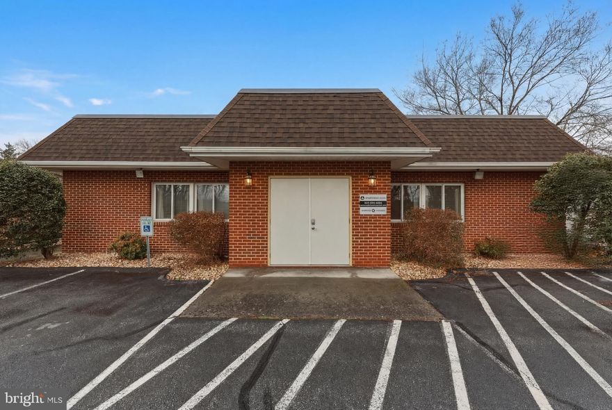 Fully renovated, turnkey commercial office building located on highly visible Winchester Ave (Rt. 11) in Martinsburg, WV. This former medical office offers flexible professional office space ideal for medical, dental, legal, or general office use. The layout includes 5 private offices, a conference room, receptionist area, copy room (previously reception), kitchenette, utility room, and storage space. The property is handicap accessible, providing ease of access for clients and staff. Situated on a high-traffic corridor with an AADT of 9,968 (2023) just north of the property, this location offers excellent exposure and accessibility for any business. Private on-site parking lot with 13 spaces adds convenience and functionality. Prime opportunity for owner-users or investors seeking a move-in ready commercial property in a strong Martinsburg location.