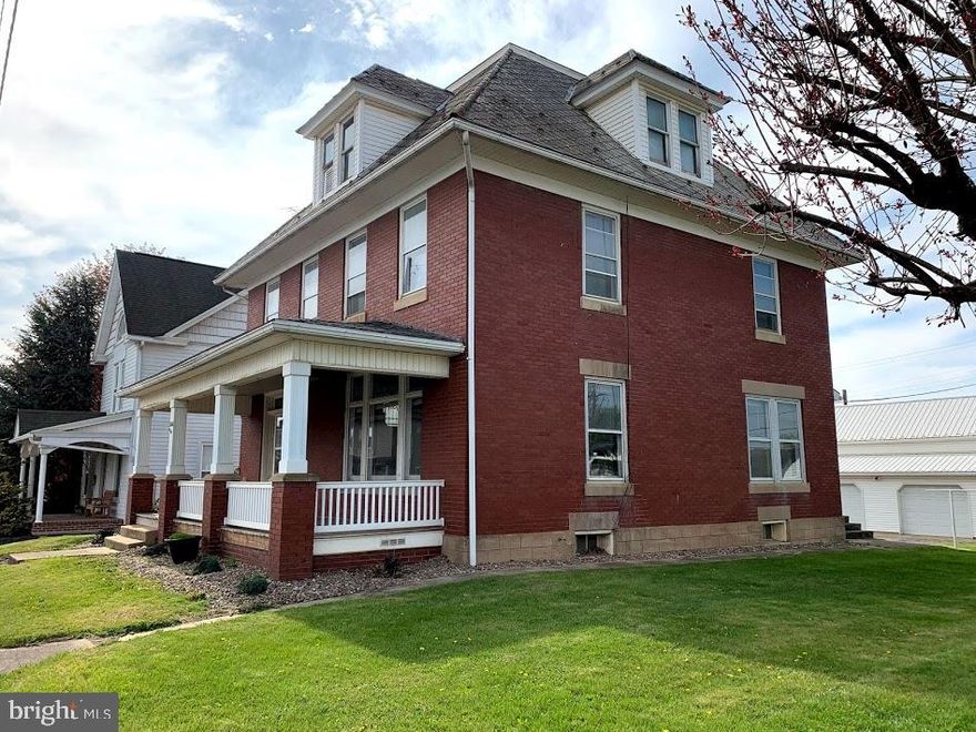 Channel your inner Joanna Gaines!!  1800 sq ft brick home in Port Royal Borough just two blocks from Juniata County Fairground & Port Royal Speedway.  Hardwood floors, pocket doors, stained glass windows and gorgeous woodwork add charm and character throughout. Living room, formal dining room, kitchen and full bath on first floor. Welcoming foyer with grand staircase leads to 4 bedrooms and another full bath on 2nd floor.  Spacious third floor loft and separate room could be finished living space.   Oil h/w heat. Covered front & rear porches.  Plenty of space to entertain in the backyard.  Detached 2 car garage with workshop, woodstove & storage space above. Zoned General Highway Commercial. Selling as is. Call today!