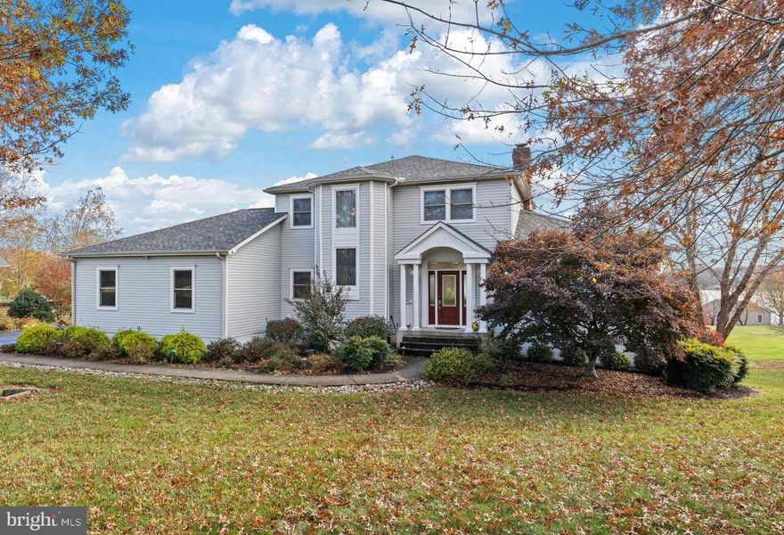 Welcome to your fully furnished, turnkey waterfront retreat—nestled on the public side of Lake Anna, Virginia. Great lake location with deep water  (8-9 feet at the end of boathouse!), this custom-built home is the ultimate escape for anyone loves peace, play, and panoramic water views. Spanning 4,400+ finished square feet across three beautifully finished levels, this 5-bedroom, 3.5-bath home is designed for comfort, entertaining, and soaking in lake life. Step into elegance with soaring 9-ft ceilings, gleaming hardwood floors, and classic crown molding throughout. The open-concept heart of the home features a cozy wood-burning fireplace in the family room, flowing into a bright breakfast nook and gourmet kitchen with stainless steel appliances, granite countertops, and a show-stopping center island perfect for gathering. Your main-level primary suite with deck access overlooks the water and features, a walk-in closet, jetted tub, and a luxurious tiled shower. Upstairs, guests and family can unwind in three spacious bedrooms and a full bath. The fully finished walkout lower level is an entertainer’s dream, complete with a 5th bedroom, full bath, second family room, wet bar, and recreation space. Outside, paradise awaits. Follow the lush, grassy lawn to your private covered boathouse with an electric lift, storage, and sundeck, ideal for morning coffee or sunset cocktails. Enjoy 200 feet of bulkheaded shoreline, a concrete patio with a built-in fire pit by the water, plus another massive patio with a second fire pit and plenty of space for lakeside BBQs. The oversized 3-car garage, paved driveway, extensive hardscaping, and 1-acre lot make this home as practical as it is beautiful. Just minutes by boat or car from Tim’s at Lake Anna, Below Deck LKA, Moo Thru Ice Cream, groceries, breweries, wineries, and more. Recent upgrades: new roof (2023), high-end HVAC systems (2023), new boathouse roof (2019), all new sliding doors (2021), and more! See MLS docs for the full list of improvements.