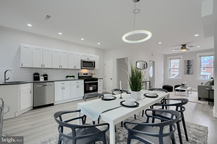 *Ask LA about Special Seller Concessions*  Beautifully Renovated! Open Layout! All new Kitchen with Stainless Appliances, Quartz Countertop, Coordinating Tile Backsplash, Wood Shaker Cabinets, Upstairs Bathroom features Custom Tilework, Designer Fixtures, and Designer Lighting. Basement Suite includes Family Room, Bedroom and Private Full Bathroom with Custom Tilework and Designer Fixtures. New Flooring and Carpet, 2 Porches, New HVAC, Cool Modern Lighting. You will Love this Well lit, Happy Home!   Also see our 2 other Models on this block, 4003 Fairfax, and 4004 Fairfax.
