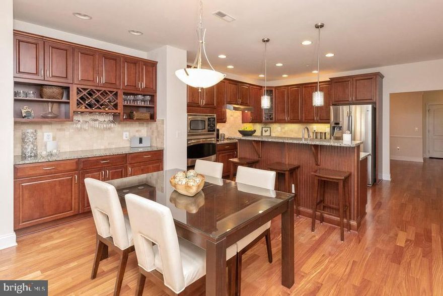 PRICED TO SELL!! SUNNY, OPEN & AIRY 4BR, 3.5BA VILLA in Tollgate Village. Bel Air's finest 55+ active adult community, this STUNNER HAS IT ALL!! This much-loved home has been impeccably detailed by the original owners.  Upgrades include: GOURMET kitchen with GRANITE countertops, S/S Appliances,  downdraft countertop STOVE can  convert to GAS GRILL, under cabinet lighting, wall M/W + separate CONVECTION/CONVENTIONAL OVEN, center island with single large/deep sink, a BUTLER'S PANTRY/DRY-BAR with abundant cabinetry, bottle and stemware racks, gorgeous MAHOGANY WOOD FLOORS on main floor, main-floor Master Bedroom Suite with bump-out sitting/dressing area, California Closets, neutral wall-to-wall carpet and master bath with tumble-tiled deep stall shower with built-in bench. Skylights and French doors in sun-drenched great room that open to a large composite deck with electric awning all overlooking the private backyard. Formal dining room and BONUS Room could be your home office, 4th BR or sitting/hobby room... YOUR CHOICE! Hardwood stairs lead to upstairs LOFT that overlooks the main floor great room. 2nd Master Suite has full bath with dual access, 2 walk-in closets and bumped-out sitting/dressing area, all carpeted. BR 3 is fully carpeted with bump-out and large closet.  Utility closet has tankless water heater. The Lower Level is fully finished, wired for sound system perfect for entertaining and relaxing.  Dry-Bar with rough-in to easily conversion to wet-bar, wall-to-wall carpet. Full bath, Pool table. Glass panel doors open to Paver Patio with extensive land and hardscaping including built-in 'WEBER' natural gas BBQ grill. EACH FLOOR HARDWIRED FOR INTERNET/ETHERNET. This is a mint home in a wonderful 55+ community.  SUBMIT ALL REASONABLE OFFERS!