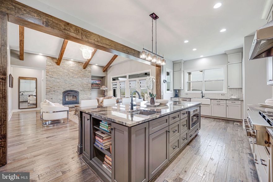 🎉 WELCOME TO YOUR FOREVER HOME IN LOVETTSVILLE, VA! 🎉  SELLER OFFERING 2/1 Buy Down!
Luxury farmhouse vibes, countryside charm, and all the cozy feels—this custom-built beauty is more than just a house…it’s a lifestyle upgrade.

✨ First impressions? Jaw-dropping.
2.66 acres of open space, a circular driveway that screams “elegance,” and mountain views that belong on a postcard. And get this—the HOA is just $200 a YEAR. (Nope, not a typo. Yes, that’s amazing. 💰)

🌄 WHY LOVETTSVILLE?
Imagine sipping wine at nearby vineyards, hiking the Appalachian Trail on weekends, kayaking the Potomac, and still being just a quick hop to Leesburg & DC. Add in Lovettsville’s legendary festivals, and you’ve got the perfect blend of small-town charm + modern convenience.

🏡 THE HOME ITSELF? A SHOWSTOPPER.

✨ MAIN-LEVEL PRIMARY SUITE

Spa-worthy bathroom = pure relaxation

Walk-in closet that feels like your own boutique

Floor-to-ceiling windows flooding the room with light

The perfect escape at the end of your day

🔥 FAMILY ROOM GOALS

Vaulted ceilings + exposed beams = rustic luxury

Wood-burning fireplace powerful enough to heat the whole house (and perfect for cozy nights in)

Massive windows with endless views of the Blue Ridge Mountains 🌲🏔️

👩‍🍳 THE KITCHEN DREAMS ARE MADE OF

Stainless steel everything

Granite counters + farm sink + pot filler (yes!)

Double wall oven + oversized pantry = chef’s paradise

Designed for entertaining—always part of the action

📚 WORK + PLAY PERKS

Dedicated custom-built office (WFH never looked so good)

Upstairs: 3 spacious bedrooms + loft/rec room with killer views

Basement: fully finished, walk-out, with space for a gym, theater, guest suite—you name it

💎 BONUS DETAILS YOU’LL LOVE

ALL closets = custom (no boring wire racks here)

3-zone HVAC, hardwoods everywhere, high-end window treatments

Starlink internet (stream, game, or Zoom—no buffering!)

EV charging in garage + chandelier lift system (yes, really!)

Expansive deck + circular driveway + future pool/fire pit potential

🌟 BOTTOM LINE:
This home is luxury, comfort, and countryside magic rolled into one. You’ll laugh, you’ll host, you’ll make memories for a lifetime—and it’s all waiting for you right here in Lovettsville.

📞 Don’t wait—call today for your private tour. Homes this special don’t stay secret for long.