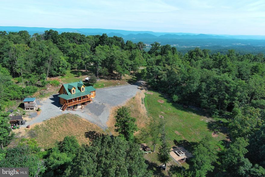 HEAD FOR THE MOUNTAINS! CUTE CUSTOM LOG HOME ELEVATED AT 1500 FT A TOP "MIDDLE RIDGE" ON 20 ACRES OF 100% USABLE LAND. BIGGER THAN IT LOOKS....OVER 2400 SQ FT OF FINISHED LIVING SPACE FEATURING EXPOSED BEAMS, BAMBOO FLOORING, SOAPSTONE COUNTERTOPS & VANITIES, SUPER EFFICIENT DUCTLESS MINI SPLIT HVAC, ETC. THE LAND OFFERS OUTSTANDING HUNTING, ATV TRAILS, PLENTY OF ROOM TO SHOOT AND PLEASING VIEWS THAT COULD BE EVEN BETTER WITH A LITTLE MORE TREE REMOVAL. SO PEACEFUL, PRIVATE & QUIET YET ONLY 10 MINUTES FROM THE ADORABLE TOWN OF FORT ASHBY. LOCATED IN THE PRESTIGIOUS GATED COMMUNITY OF "THE BLUFFS ON THE POTOMAC".....THE BLUFFS IS KNOWN FOR IT'S ABUNDANCE OF BIG BUCKS, BEAR & TURKEY. AS AN ADDED BONUS, THE COMMUNITY HAS IT'S OWN PRIVATE COMMON AREA ON THE SOUTH BRANCH OF THE POTOMAC RIVER FOR CANOE, KAYAK, TUBES, FISH & SWIM......A PRIVATE PARK ON THE RIVER FOR YOUR SUMMERTIME ENJOYMENT. THE PERFECT WEEKEND ESCAPE OR FULL TIME SPREAD FOR THOSE LOOKING TO KEEP IT SIMPLE. AN INCREDIBLE VALUE IN TODAYS MARKET AT UNDER 500K! WHAT ARE YOU WAITING FOR? TREAT YOURSELF TO THE GOOD LIFE IN ALMOST HEAVEN!