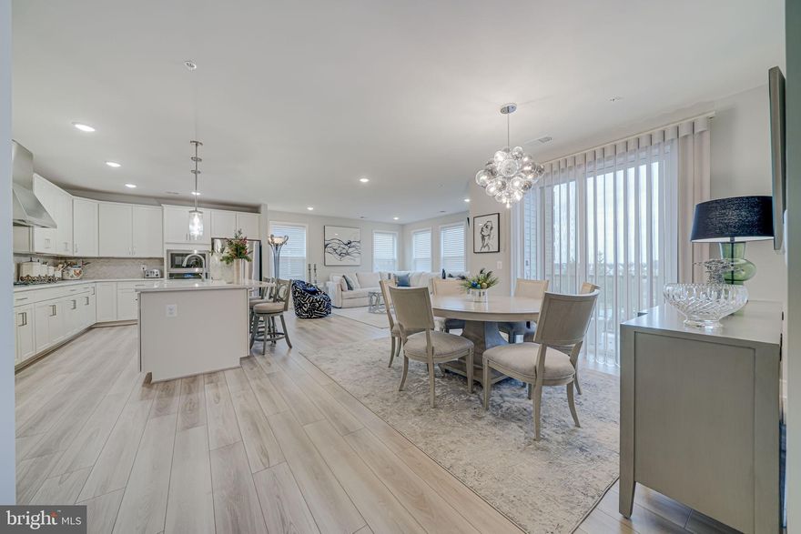 Impeccably Maintained Luxury Condo with Custom Finishes and Included Furnishings in a Premier 55+ Community Located in desirable Brambleton 

Welcome to this 2,149 sq. ft. luxury 3-bedroom, 2-bathroom condo, where impeccable design and turnkey convenience await. This home has been meticulously cared for and showcases thoughtful details that elevate its style and comfort. Best of all, select furnishings and artwork convey, making your move effortless and seamless.

Features You'll Love:

Custom Paint: Designer-selected paint in a neutral l palette creates an inviting and sophisticated ambiance.
Custom Silhouette Window Treatments: High-end, stylish window coverings provide the perfect balance of privacy and light.
Included Furnishings: The living room and dining room rugs, furniture, and art are included, adding timeless elegance and personality to your new home.
Spacious and Bright Layout: The open floor plan seamlessly connects the living, dining, and kitchen areas, offering an ideal space for entertaining or relaxing.
Modern Gourmet Kitchen: Outfitted with premium appliances, ample cabinetry, and sleek finishes, this kitchen is as functional as it is beautiful.
Luxurious Bedrooms: The primary suite is a tranquil retreat with a spa-like en-suite bath, while the additional bedrooms provide flexibility for guests or hobbies.
Sophisticated Bathrooms: Thoughtfully updated with contemporary fixtures and finishes.
Community Perks:
Located in a sought-after 55+ community, this condo provides more than a home—it offers a vibrant, stress-free lifestyle. Amenities include:

Clubhouse for social events and activities
Fitness center to support a healthy lifestyle
Walking trails and beautifully maintained grounds
Easy access to shopping, dining, and healthcare services
Why This Home is Exceptional:
At 2,149 sq. ft., this condo combines spaciousness with upscale living. The inclusion of select rugs, furniture, and art means you can start enjoying your new home immediately. Move in with confidence knowing the home is in pristine, model-like condition.

Don’t Wait!
Schedule your private showing today and experience this extraordinary property for yourself. With its custom finishes, included furnishings, and prime location, this condo is a rare find in a vibrant, age-restricted community. Call JULIE SAPONE TODAY!