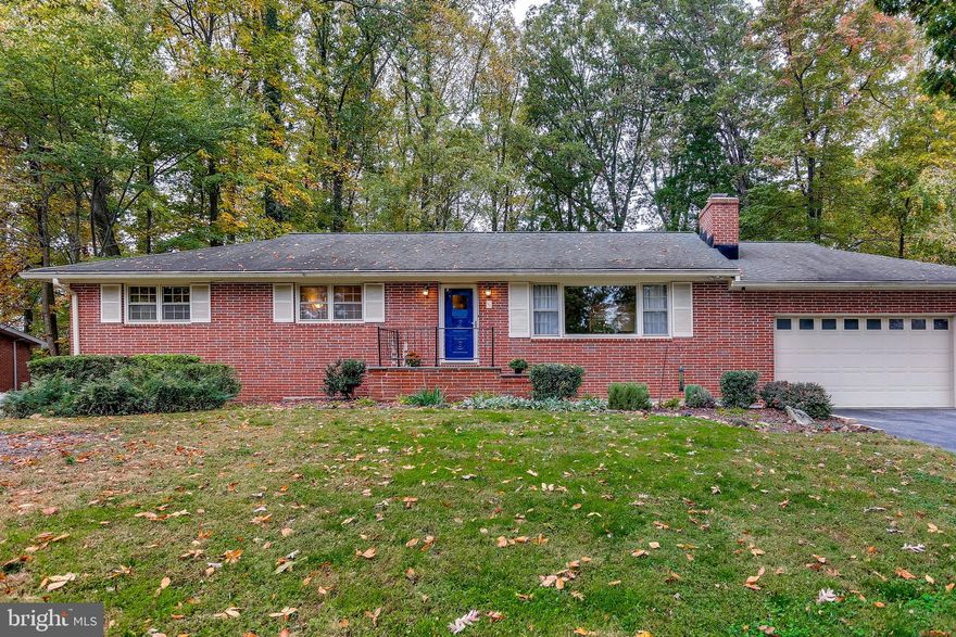 Lovely 4 bedroom, 2.5 bathroom Rambler on over half an acre! Large rear fenced backyard perfect for outdoor activities or children's playground. The entry of the home opens up to the spacious living room with a wood burning brick surround fireplace and mantel. A pass-through window between the living room and kitchen offers convenience for entertaining. Ample natural light pours into the living room from the oversized window. Hardwood flooring runs throughout the main level except for ceramic tile in the foyer, kitchen, bathrooms and laundry room. The dining room provides a touch of elegance with chair railing and crown molding. The kitchen has a breakfast bar, plenty of counter space and newer appliances. The laundry room is equipped with a utility sink and additional storage space. A half bathroom is connected to the laundry room. The primary bedroom offers two closets and an updated on-suite bathroom. Bedrooms 2 & 3 are located across from the primary bedroom with a beautiful full hall bathroom. The lower level bedroom & recreation room features PetProtect carpet (2017) and walk out stairs to the backyard. The L shaped recreation room allows for this space to be multi-functional for all family members. The den/office offers a separate, quiet space in the lower level and includes a cedar lined closet. The most recent upgrades include: Refrigerator & Microwave (2020), Clothes Washer (2019), Updated Half Bathroom (2019), Security System (2018), Sewer Line Replacement (2018) and Garbage Disposal (2018), Completely repainted interior (2017), Extra insulation throughout including blown in insulation in attic and crawl space (2017), updated light fixtures including new LED lighting in kitchen (2017). Great location with easy access to Route 40. Lots of dining and shopping minutes away!