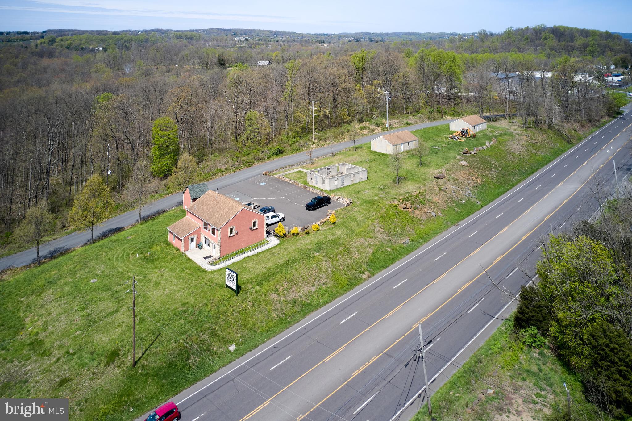 2 unit office/retail space available with parking lot, 5 contiguous parcels along rt 309 between Quakertown and Coopersburg. Highway Commercial Zoning. Access From Clay Rd. Retail shop and parking lot and additional buildings Property for sale, or lease to a single occupant or separate units on each floor. Each unit has an ADA bathroom. There is a ramp from the main parking lot for ground level entry to each unit. Excellent opportunity for a retail or office space. Additional buildings on the property.