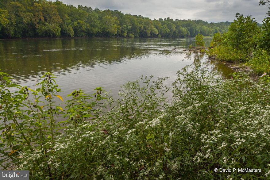 Colorful, modern, contemporary-style home with open floor plan, conveniently located on the Potomac River, less than 2 miles from Historic Shepherdstown, which offers wonderful restaurants, cool shops, Shepherd University and so much more.  Enjoy year-round river views and 50 feet of riverfront, where you may swim, canoe, kayak, or go tubing.  This beautiful property, with over a half acre of land, large front yard, shared driveway, and fish/frog pond, is also near the historic Shepherdstown Battlefield, which is both behind the house and to the side.
