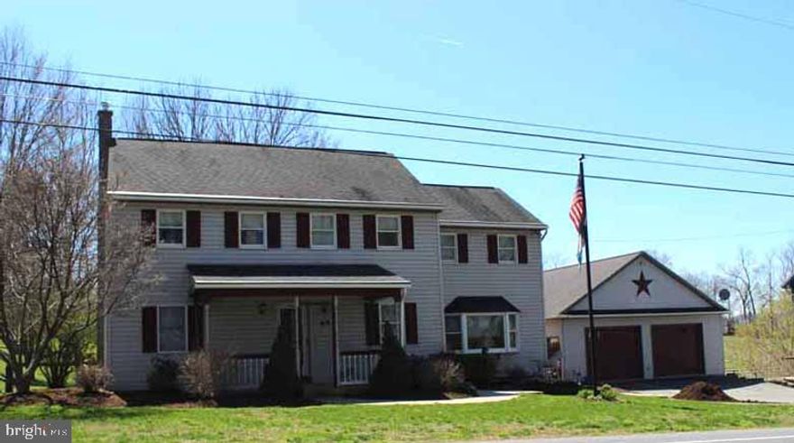 7.3 acre horse farm out in the country yet easy access to route 30 and 283. Possible income property with boarding of horses. Dog Kennel/Training. Water and electric to all pastures. Large deck with built in hot tub. Heated garages with shop on lower level. Sand filled riding ring with lights and 2nd sand area for round pen. Large bank barn and  separate 3 stall horse barn with hot water. See attached features list.