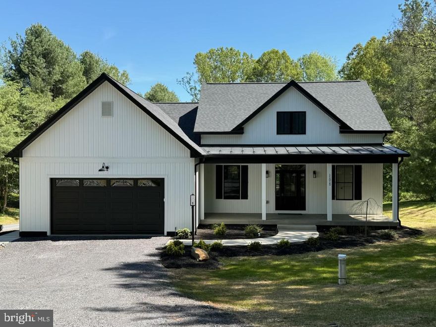Welcome to The Duke Farmhouse — everything you never knew you needed, wrapped in timeless charm and thoughtful design.

Set on a gently rolling 1.4-acre homesite, surrounded by a mature cherry tree and peaceful countryside views, this inviting property offers the perfect blend of comfort and style — no HOA.

Step inside to the heart of the home: a stunning vaulted family room that flows seamlessly into the open-concept kitchen, creating an ideal space for gathering and entertaining. The vaulted primary suite offers a private retreat, complete with a spacious walk-in closet and spa-inspired bath.

Two well-appointed secondary bedrooms share a full bath, while a separate walk-in laundry room adds everyday convenience — making this home perfect for families or those looking to downsize without compromise.

Enjoy quiet mornings and golden hour evenings on the front and rear porches, and take advantage of the full unfinished basement, offering endless possibilities for future expansion. A rare opportunity to own a beautifully crafted farmhouse with room to grow — in a setting you’ll never want to leave. Upgrades galore! Taj Mahal quartz countertops! Marvin windows! KitchenAid appliances! 9” white oak LVP flooring!