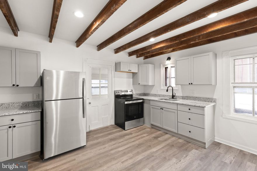 Renewed downtown Winchester 2 bedroom apartment with hardwood floors, new kitchen and bath, and appliances and the only utility you are responsible for is  electric.  You have the entire first floor to yourself and all the rooms are generous with separate dining and living rooms, a jack and Jill bath and one designated off street parking space.  You do have outside common area to relax in the spring/summer/fall months.  *Coined operated laundry on site*  Owner/Agent