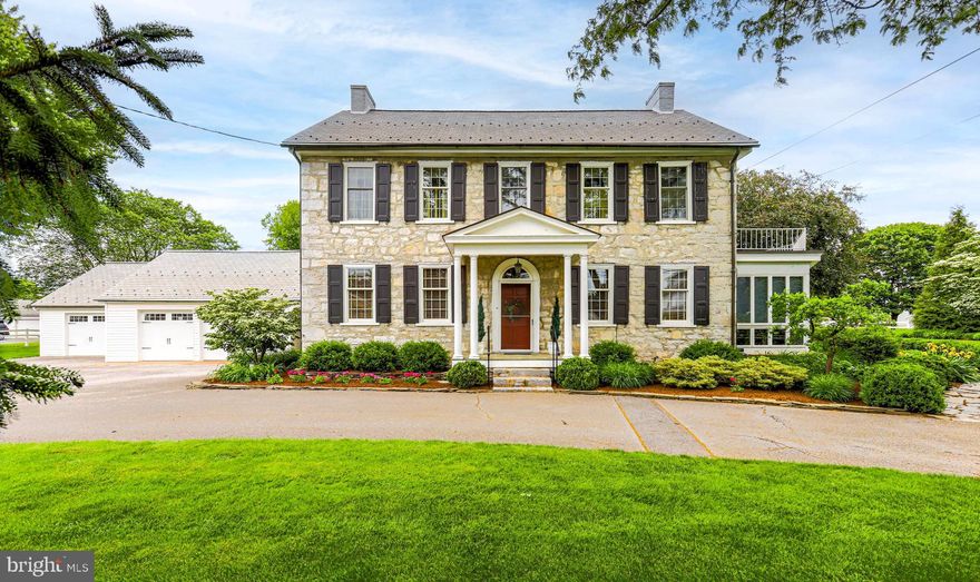 Built in 1804, this beautifully maintained stone home sits on over an acre and blends historic charm with modern updates. Original restored wood floors, three gas fireplaces, and central air-conditioning highlight the home’s character and comfort. The updated kitchen and renovated primary bath offer modern convenience while preserving the home’s timeless appeal. 

Enjoy relaxing in the three-season sun room or entertaining in the finished basement, complete with marble flooring and a pool table. Numerous upgrades have been completed throughout the home, including kitchen and bathroom updates, replacement windows, updated wiring, and the house roof was replaced within the last six years. The home is serviced by public water and public sewer, with an additional well and multiple hydrants throughout the property.  Heating is provided by an oil, hot-water baseboard system.

 The outdoor living space is designed for entertaining and relaxation, featuring a covered patio, pergola, fire pit, grill area, water feature, and beautifully landscaped flower gardens across the 1+ acre property.
Additional features include a four-car garage and a private apartment above the garage, ideal for guests or extended family.  Seller will provide a home warranty for added peace of mind.