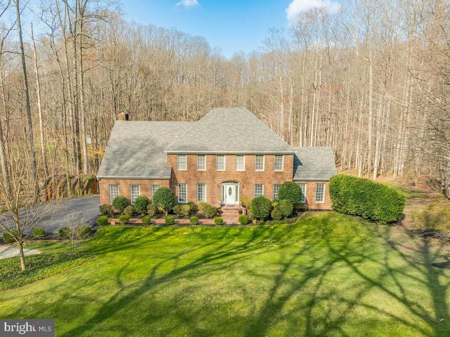 Welcome to this beautiful home tucked away in the highly sought after neighborhood of Lyons Creek Hundred.  With five spacious bedrooms, there is ample accommodation for family and guests.  In the spacious kitchen you'll find upgraded appliances, new lighting, granite tops and views that open to the family room, complete with a cozy wood burning insert fireplace - the ideal setting for intimate gatherings or lively family evenings.  The main level has beautiful hardwood floors, adding warmth to the living space.  Step outside onto the back deck, where you can bask in the sun, or host evening dining experiences overlooking the meticulously landscaped yard that includes a large lower level patio that steps down to the pool area. Here you can layout around the pool, jump in, or even relax in the in-pool lounge area!  Off to the side of the pool there's also a large firepit for great hangouts with friends and family.  As you explore further into the property, you'll discover a stocked pond with a center fountain, creating a scenic backdrop for outdoor activities and moments of tranquility. Retreat to the sunroom, where natural light illuminates the space, providing lovely views of the back yard and pool area.  A separate deck offers the perfect spot for morning coffee or evening cocktails.  Don't forget downstairs as you head to the finished lower level, where entertainment awaits at every turn.  Whether you're unwinding in the media room, hosting gatherings in the massive  bar area, or staying active in the weight room, this lower level offers endless possibilities for leisure and enjoyment.