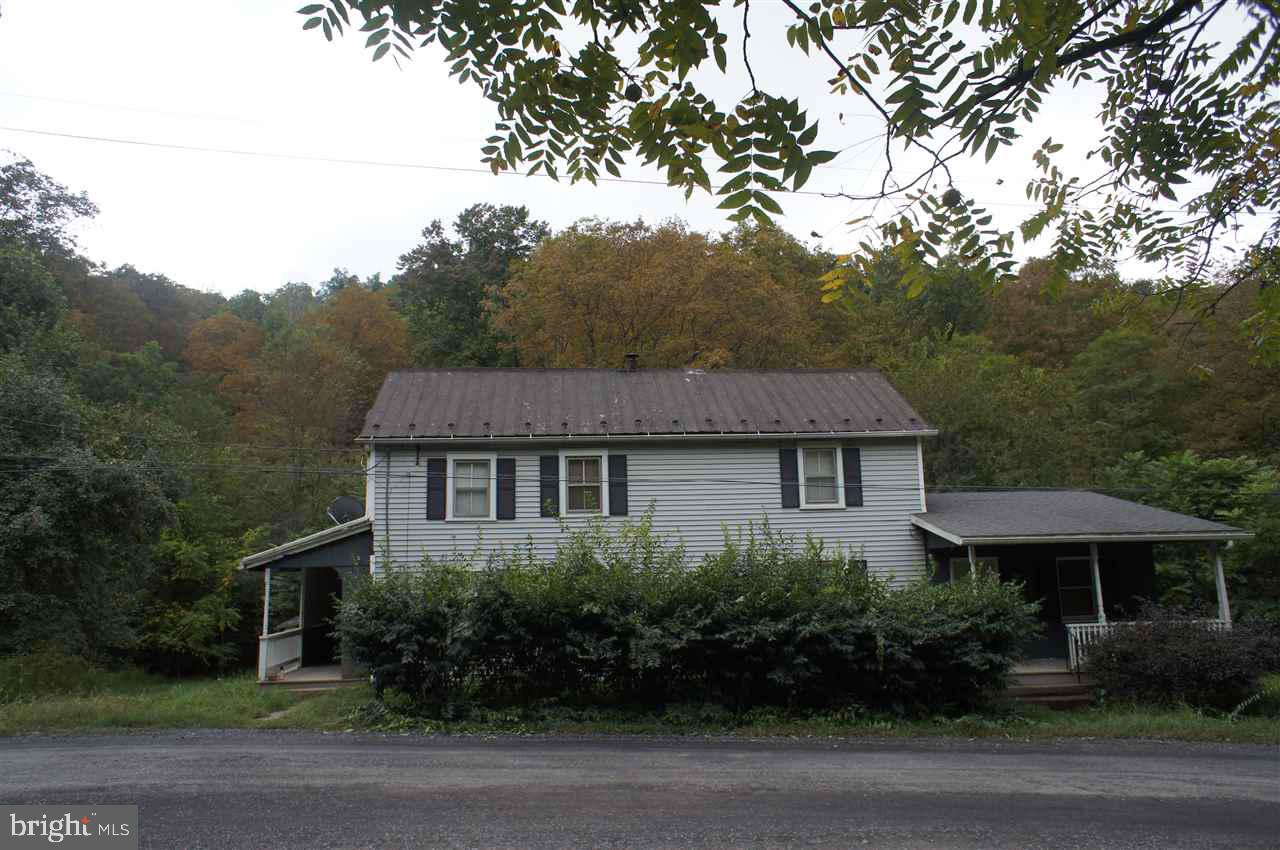 Don't miss out on this one, Unique property with 106 acres plus a two story home featuring two bedrooms, two bath, Living room, Lg. Dining room, Large Kitchen with oak cabinets , Lg. Family room, and a small stream. wired for generator. Abundant wildlife for the hunting or nature enthusiast. This property would make an awesome mountain retreat or Hunting lodge. Located beside Fowler's Hollow State Park and Tuscarora Forest. Sold "AS IS"