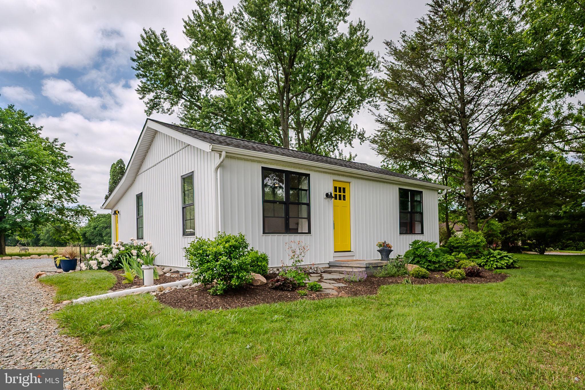 OPEN HOUSE CANCELLED DUE TO SELLER ACCEPTING AN OFFER.This modernized 1950’s ranch is straight out of a magazine. Renovated from top to bottom in 2021 to incorporate a seamless combination of contemporary and rustic. Every detail, every fixture, carefully selected to evoke a sense of calm and unmistakable connection to the natural beauty surrounding this home. Yellow pine floors extend throughout the beautiful open living space joining the living room and kitchen, for a comfortable and soothing daily routine. The corner living room has lovely natural light and convenient desk nook. The sleek white kitchen features stainless steel appliances, contemporary hood, quartz countertops, charming open shelving, abundant cabinetry with floor-to-ceiling pantry, and a perfect window seat with a view! Step out to the back porch/sunroom to dine with gorgeous views through a wall of windows, heated floors, and a convenient custom storage cubby as you enter from outside. Down the hall from the kitchen you will find the stunning primary bedroom with custom accent wall and inset shelf, expanded custom closet/dressing room, and a full bath with double quartz vanity and heated floors. A refurbished barn door leads downstairs to the lower level with another beautiful living space accented by exposed beams and accent wall. Also on this level, the second private flex room, used as a bedroom, adjacent full bathroom and under-stair closet, and laundry. In addition to the countless newer interior features, there are a substantial number of major system upgrades including: newer exterior, roof, siding, black windows, HVAC, water softener with UV light system, French drain and sump pump, whole house surge protector, and tankless water heater. Outside, you will find established garden beds ready to grow your vegetables and spices, as well as an outdoor shed for storage. Situated on .55 acres surrounded by farmland, yet close to everything this area has to offer, Routes 896 and Route 1 for commuting, and within Avon Grove School District. This home is an absolute gem! Be sure to schedule a showing today!