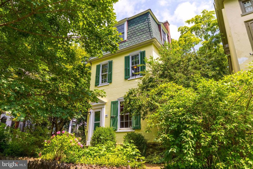 Old world charm, modern amenities, and stellar location come together in this fabulous farm house. From its perch just above street level, this home has  much  to offer. The first floor includes a tiled entry area, open living room with bow window, separate dining room with built-in china cabinet, and wonderful cooks kitchen with maple cabinets, granite counters, stainless steel appliances, and sliding doors to the back yard. On the second level you will find a spacious main bedroom with vaulted ceiling and dressing area, second nice sized bedroom, third bedroom with build in book shelves, and hall bath with claw food tub. An addition three bedrooms and bath on the third floor round out this homes generous amount of living space. The rear yard is serene and has plenty of space for gardening , playing, and entertaining. The location can't be beat...A few blocks to Weavers Way Coop, High Point coffee, Carpeneter's woods, the trails of the wissahickon, and easy access to both train and bus.