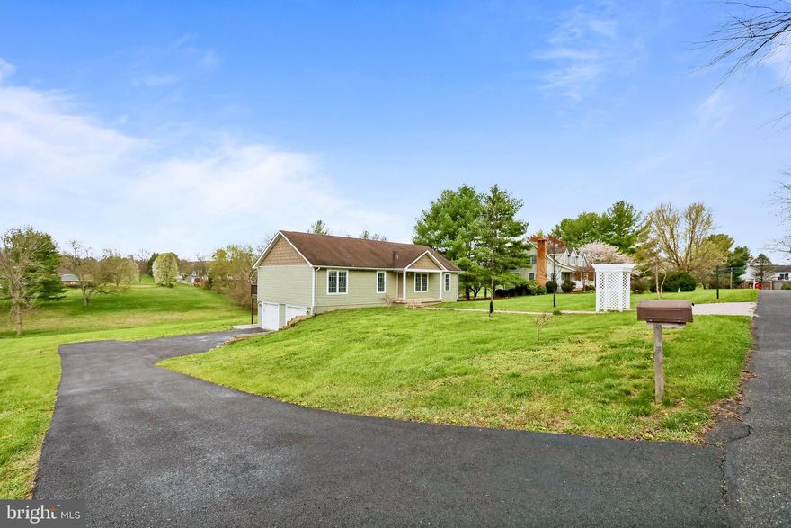 4 bedrooms, 3 full bathrooms on 1 acre of land with a spectacular view of the mountains.  Main level primary bedroom with fully remodeled primary bathroom.  Wood floors throughout main level.  Oversized 2 car garage.  2 decks and a covered front porch.  Oven replaced 2021, Washer & dryer replaced 2021, water heater replaced 2023, well pressure tank & pump replaced 2021.  Salt based water treatment filter replaced 2023.