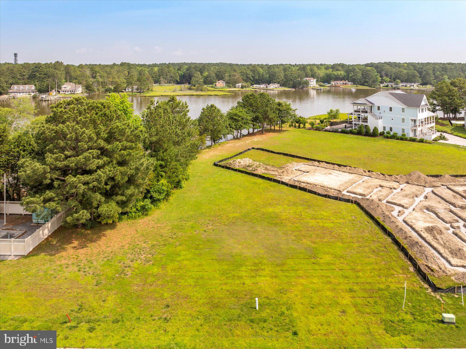 Exceptional Waterfront Lot in Glen Riddle – Build Your Dream Estate. Discover one of the last remaining premier waterfront parcels in the sought-after gated community of Glen Riddle. Nestled on .39 acres along picturesque Turville Creek, this rare lot offers over 8,000 square feet of buildable footprint and 50-foot setbacks from the bay—a unique opportunity for expansive, custom home design. Enjoy breathtaking west-facing sunset views, privacy with community-owned green space on the western border. The lot allows you to bring your own builder with no required timeline to build. Architectural design subject to association approval. Glen Riddle offers world-class amenities: a community boat ramp and docks, outdoor pool, tennis courts, state-of-the-art fitness center, clubhouse, golf course and game room. Now’s your chance to invest in the coastal lifestyle and create a stunning waterfront retreat tailored to your vision.
