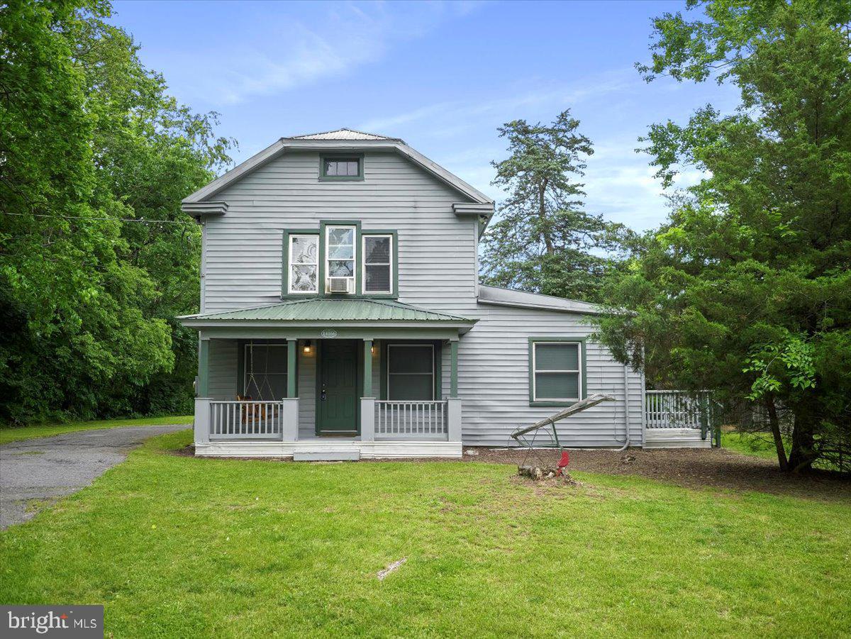 BACK ON THE MARKET AND A PRICE APPROVEMENT!! THIRD TIME'S THE CHARM...Welcome home, welcome home, welcome home! This adorable 2bd, 1bth farmhouse is situated on 2.00 beautiful, serene, UNRESTRICTED acres. This home is busting at the seams with charm and easy living, perfect for anyone who is looking for land and functionality. As you come in, you will find on the main level a large LR, an extra large dining room that could also be used as a flex space, a perfectly suitable kitchen, one very roomy bathroom, and extra large laundry room that also offers storage! Upstairs you will find two impressively large bedrooms and attic access. The walkable attic is perfect for additional storage. This homes offers more than enough living space and would be easy to customize to your liking. There is no real way to capture the peacefulness of the land but to go see it yourself. This home also features two large out buildings bursting with rustic charm! Perfect for your tractor, feed for your any livestock, and yard tools! The covered porch, tin roof and swing will make you wish for more rainy days, as you sit out and enjoy. In addition, you are located close to commuter routes, dining, and in a highly sought after school district.