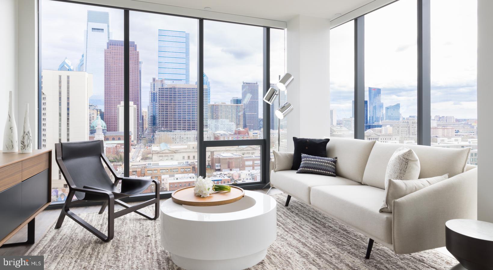 Welcome to NorthXNorthwest, a premier residential destination in Philadelphia’s iconic Art Museum neighborhood where refined living meets modern design, all set against the backdrop of some of the city’s most treasured cultural institutions. Designed for those who seek a vibrant city lifestyle without compromising comfort, elegance, or convenience, NorthXNorthwest elevates apartment living into a curated experience.
The architecture of NorthXNorthwest is a striking blend of contemporary form and urban sophistication, with expansive glass facades and sleek lines that mirror the dynamic spirit of the neighborhood. From the moment you step into the grand lobby, you’re met with a sense of calm and style—soaring ceilings, sophisticated finishes, and thoughtfully designed spaces that instantly signal this is more than just an apartment community—it’s a lifestyle.
Each apartment at NorthXNorthwest is crafted with meticulous attention to detail, offering open-concept layouts that maximize natural light and provide seamless flow from living areas to private retreats. Floor-to-ceiling windows frame sweeping views of the city skyline, Fairmount Park, and the Schuylkill River, while wide-plank flooring, quartz countertops, and premium stainless steel appliances speak to a higher standard of urban living. Spacious kitchens feature modern cabinetry and generous counterspace, perfect for quiet meals at home or entertaining guests. Bedrooms offer a serene escape, with plush carpeting and oversized closets, and spa-inspired bathrooms provide the perfect blend of luxury and function.
But what truly distinguishes NorthXNorthwest is the amenity experience, designed with an elevated urban lifestyle in mind. At the heart of the community is a resort-style rooftop terrace complete with panoramic city views, plush lounge seating, fire pits, and grilling stations—ideal for sunset cocktails or weekend gatherings. The resident lounge is styled like a boutique hotel, offering intimate seating areas, curated art, and ample space to relax, work remotely, or meet with friends. A state-of-the-art fitness center offers top-tier cardio and strength training equipment, along with dedicated spaces for yoga and functional movement training.
For residents who work from home or require flexible workspace, NorthXNorthwest offers beautifully designed co-working lounges with high-speed internet and quiet breakout zones—where productivity meets comfort. A private screening room, on-site café, and indoor-outdoor social spaces provide thoughtful extensions of your home, with design details that reflect the building’s contemporary aesthetic.
Living at NorthXNorthwest also means immersing yourself in one of Philadelphia’s most inspiring and walkable neighborhoods. Step outside and find yourself just moments from the Philadelphia Museum of Art, The Barnes Foundation, Boathouse Row, and miles of trails along the Schuylkill River. The culinary scene surrounding the building offers everything from craft coffee shops and gourmet markets to acclaimed restaurants and hidden neighborhood gems. The streets pulse with energy—lined with tree-shaded sidewalks, historic architecture, and a rich tapestry of culture and creativity.
Future residents will love not just the space they live in, but the life they live here. NorthXNorthwest offers the rare combination of upscale design, thoughtful amenities, and a location steeped in art and culture—all brought together in one of Philadelphia’s most sought-after addresses. It’s more than just an apartment—it’s a place to truly call home.
** Pricing and availability subject to change on a daily basis ** Photos are of model units ** Parking may be available for an additional fee, subject to availability **