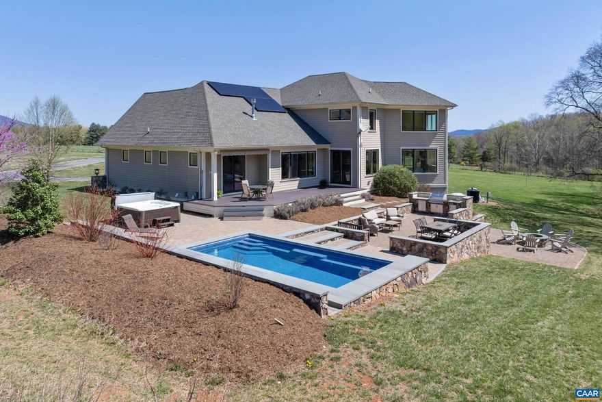 Nestled against the Blue Ridge, this distinctive Afton estate will amaze with spectacular 360 degree views! A true Net Zero property, including handsome main residence, guest cottage, barn and small vineyard. A flagstone porch welcomes you home! Open floor plan, hardwoods and exquisite finishes. Main level Owner?s Suite w/ lavish bath, gorgeous LR w/ soaring stone fireplace & captivating views of mountain & woodlands. A stunning chef?s kitchen opens to dining nook and cozy family room flanked by windows. Gleaming granite island, Thermidor range and coffee/wine bar. An outdoor retreat awaits! Heated salt pool & hot tub, dining area, outdoor kitchen & firepit, framed by breathtaking stone & babbling stream. Upper level has two bedrooms sharing a hall bath, home office and large bonus space, all with incredible views! Comfy theater/game room downstairs which opens to fabulous wine cellar, perfectly chilled for 500 bottles of wine. Huge barn w/ patio and, to top it off, there?s a detached studio cottage w/ kitchen and bath, ready for guests or vacationers! Cottage patio overlooks mountains and vineyard, perfect for crafting small batch wine. All this & located in the heart of popular Nelson151 wineries, breweries, nearby AT and more!,Cherry Cabinets,Granite Counter,Soapstone Counter,Fireplace in Family Room,Fireplace in Living Room