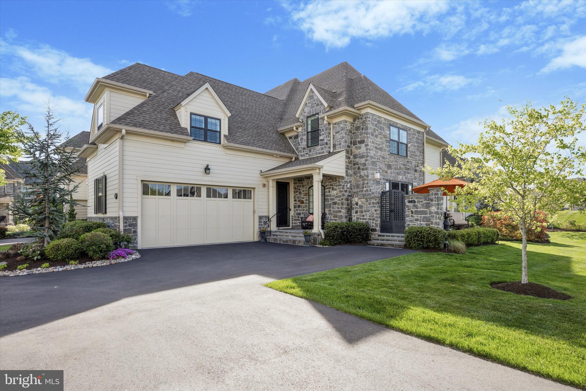 Welcome to 514 Valley Green Court. Located in the highly sought-after Reserve at Creekside, this exceptional end-unit Wissahickon model offers nearly 4,400 square feet of beautifully finished living space across three levels. With 3 bedrooms, 2 full baths, and 2 half baths, this home combines elevated finishes, flexible spaces, and thoughtful upgrades throughout. Step inside to an open, airy layout designed for both relaxed living and effortless entertaining. The expansive living area features a corner gas fireplace with custom tile surround and French doors leading to a private side deck with views of the spacious backyard. Wide-plank hardwood flooring flows throughout, creating a warm yet contemporary atmosphere. The chef-inspired kitchen is the heart of the home, showcasing a center island, granite countertops, subway tile backsplash, upgraded cabinetry, custom pantry and stainless steel appliances. An adjacent dining area flows into a light-filled breakfast nook with sliding doors opening to a second outdoor deck, complete with a custom pergola and steps down to a fire pit and lounge area—perfect for evenings under the stars. A private den/office with French doors offers a quiet space for remote work or a cozy living space . Also on the main level is a stylish powder room and access to an oversized 2-car garage with epoxy floors, built-in storage, and an EV charging station. Upstairs, the primary suite is a true retreat featuring a gas fireplace, private balcony, and a custom walk-in closet. The spa-like primary bath includes a double vanity, oversized shower with glass door, and separate water closet. Two additional, generously sized bedrooms, a hallway bath, and a convenient laundry room with custom cabinetry complete the second floor. The finished lower level offers flexible living space—ideal for a media room, gym, or guest suite and includes a half bath for added convenience. Among the many additional upgrades are recessed lighting, custom shutters and window treatments, covered sprinkler heads, water filtration system, whole house generator, irrigation system, landscape lighting, slate front porch with stone steps and stone wall with gate leading to side deck. Located between the two Philadelphia Cricket Club golf courses, the Reserve at Creekside offers a maintenance-free lifestyle with luxury amenities. The 4500 square foot clubhouse includes a large gathering space with fireplace, kitchen, fitness center and outdoor pool with covered flagstone patio. Ideally located in Whitemarsh Township, within minutes of Fort Washington and Wissahickon Parks, the shops of Flourtown and Chestnut Hill and easy access to routes 309, 476 and the PA Turnpike. Don't miss this special property!