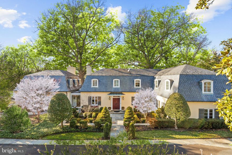 FANTASTIC VALUE! For the first time in over twenty years, Willow Oaks presents an extraordinary opportunity to acquire one of Washington's most distinguished properties. Once the residence of the late Senator Dianne Feinstein, this home represents rarely found sophistication. Located discreetly within the Spring Valley neighborhood in upper Northwest D.C., this exclusive, gated compound, encompassing 0.8 acres, features a stately main house, grand swimming pool with pool house cabana, separate pool house with dressing rooms, carriage house, and beautifully manicured gardens. The grounds of this estate offer a rare blend of opulence and privacy.

The main house features an elegant foyer, a formal living room, and a sophisticated dining room. Entertaining is elevated with a well-appointed bar, a two-story great room, and a sunroom offering panoramic views of the pool and lush surroundings. The kitchen is complete with a sunny breakfast room overlooking the mature trees. A distinctive touch is added with a private library on the main level, adorned with floor-to-ceiling bookshelves. Upstairs, three bedrooms, including a primary suite with dual bathrooms, and a lower level recreation room complete the residence. The luxurious pool, with a pool house cabana and changing rooms, offers a resort-like ambiance in the heart of the city. The carriage house includes a three-car garage, greenhouse, and spacious one bedroom apartment.  Marked by its rich history and political legacy, Willow Oaks offers unparalleled privacy and prestige.