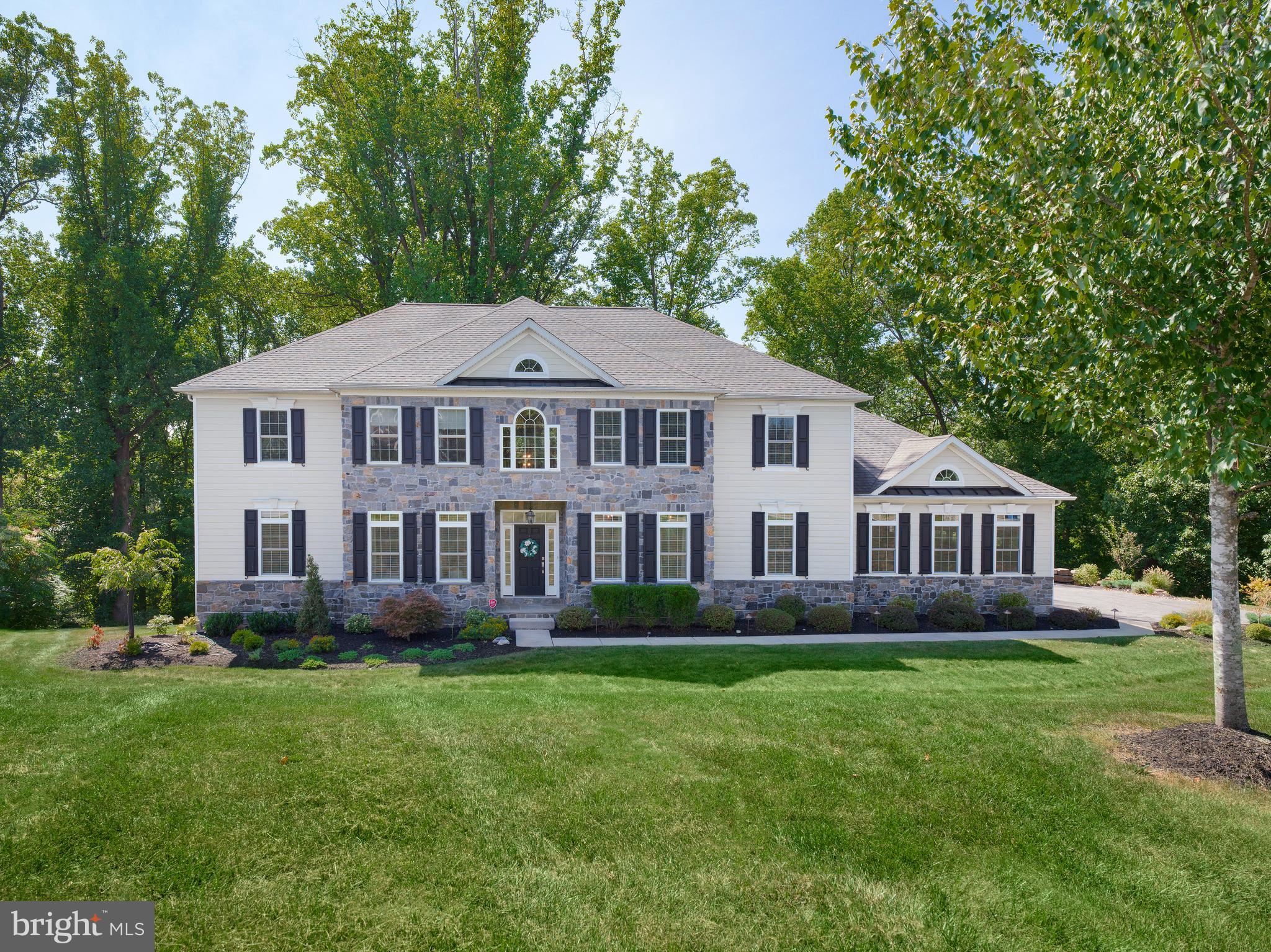 Welcome to 421 Mattrissa Ridge, a beautifully upgraded and spacious custom-built home in the award-winning Rose Tree Media School District. This 6-bedroom, 4.2-bath residence boasts over 6000 square feet of well-appointed living space, perfect for those seeking both luxury and comfort.
As you enter through the grand 2-story foyer, you'll notice the exquisite 3-piece crown molding that adorns the majority of the main level. The open floor plan seamlessly connects the designer kitchen, living room, and dining spaces, making this home ideal for entertaining. The kitchen features hardwood flooring, pristine white cabinetry, stainless steel appliances, granite countertops, a double wall oven, and a large island with additional stool seating at the breakfast peninsula. Adjacent to the kitchen, enjoy peaceful mornings in the bright breakfast room with breathtaking views or step outside onto the Trex deck to soak in the beauty of the rear grounds.
The living room is a focal point, with a stunning coffered ceiling, recessed lighting, and a gas fireplace framed by a custom mantel with dentil molding and marble surround. The first-floor primary suite offers ultimate convenience with two walk-in closets, a linen closet, and a spa-like en-suite bathroom featuring a soaking tub, granite double vanity, and large shower. A home office, two powder rooms, and direct access to the 3-car garage complete the main level.
Upstairs, you'll find four additional spacious bedrooms, each with ample closet space, including a Jack & Jill bathroom between two of the rooms. A large bonus room with recessed lighting offers flexible space for a game room or secondary office. The recently remodeled Jack & Jill bathroom adds modern touches to this inviting upper level.
The expansive walk-out lower level has been fully finished and includes a built-in bar, perfect for entertaining, as well as a sixth bedroom, full bathroom, gym or 2nd home office and an additional open living area. From here, walk out to the newly added patio and enjoy your private backyard oasis with serene landscaping, a rock wall at the base of the driveway, and beautiful mature trees surrounding the property.
Since its purchase in 2020, this home has seen several thoughtful upgrades, including new hardwood floors in the master bedroom, upstairs hallways, and living room, fresh interior paint throughout, and significant outdoor enhancements such as fully landscaped the entire property,added back patio, drainage under back deck and driveway extensions.
Located just minutes from the charming town of Media with its excellent dining and shopping, and with easy access to the Philadelphia Airport, I-95, and local parks, this home offers the perfect blend of peaceful, country feel and modern convenience. Situated in a quiet, friendly neighborhood, this move-in-ready home is the ideal setting for family living, with its generous storage space, finished basement, multiple outdoor areas, and proximity to top-rated schools.
Don’t miss your chance to own this impeccably maintained home in one of Media’s most desirable locations!