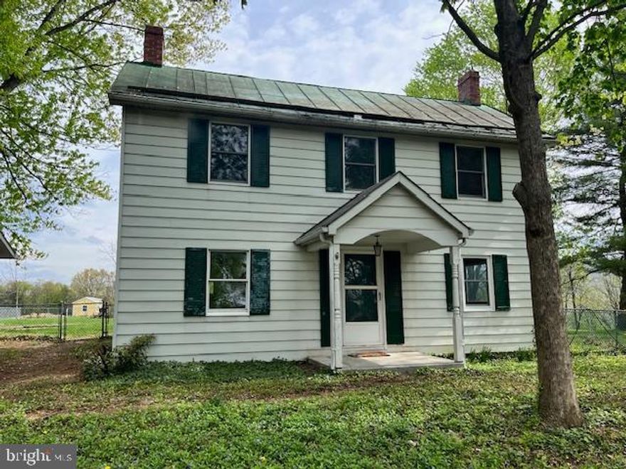 COMING SOON, This charming Colonial-style home, built in 1890, offers a blend of classic character and modern convenience. With 1,672 sq. ft. of living space, the interior features solid hardwood and vinyl flooring, creating a warm and inviting atmosphere. The eat-in kitchen is equipped with an electric oven/range and a refrigerator. Enjoy the traditional floor plan with built-ins, an entry-level bedroom, and a bathroom featuring a tub and shower. The exterior boasts aluminum siding on a level on a .55-acre lot, providing ample room for outdoor activities. The property includes a detached garage with side entry and a gravel driveway. Enjoy scenic views of the garden, lawn, and surrounding mountains from your front and fenced rear yard.  Located in a peaceful rural setting, this home is not part of a development, offering privacy and tranquility. The community is known for its rural atmosphere, with nearby parks and recreational areas for outdoor enjoyment. Local schools are within easy reach, providing quality education options. Public services are readily available, ensuring convenience for residents. This property presents a unique opportunity to own a piece of history while enjoying the benefits of a vibrant community. Don't miss your chance to make this charming residence your own!