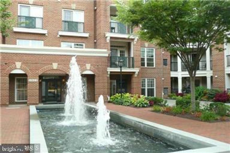 Come enjoy living at Saintsbury Plaza an active 55+ community with a lovely courtyard and fountains, club room, fitness room, library, jogging trails.  A perfect location "too" enjoy being across the street from the Vienna Metro, mins to I-66, Rt. 50, Nottoway Park, Pam Am Shopping Centre, Providence Community Center with a pool, and all the amenities of Fairfax, Vienna & Oakton.  The Club Room has many activities such as Wednesday morning coffees, Friday evening Happy hours, canasta, bridge, and a book club.  Nature too plays a role in making the Plaza a special place to live with all its greenery and beautiful flowers. Full time resident Manager!  Elevators in all the buildings! 
 Spread out & enjoy living in  this lovely, large unit (1586 sq. ft of luxury) Step into an inviting foyer and then enjoy the spacious living room with lovely built-ins & opening to the balcony which backs to the lovely treed section of the Plaza , a perfect spot for that morning cup of coffee or late afternoon cocktail!  The separate dining room with hardwood flooring -great for entertaining or for enjoying a quiet dinner at home. The large kitchen, with hardwood flooring, offers lots of cabinetry for all you favorite dishes and supplies...lots of work space as well.. updated countertops, Stainless steel French door refrigerator, stove and double sinks, island and pantry too! The Primary suite consists of a spacious bedroom, a sitting room with wonderful built-ins & bar and luxury bath with double vanities and private areas, plus a walk -in closet and a second hanging closet! A second bedroom, a full bath with a walk-in tub separated on the other side of the condo for privacy.  Don't  miss the powder room and the utility closet as well w appliances!
THIS ONE IS A MAZING! A WONDERFUL PLACE TO  CALL HOME!