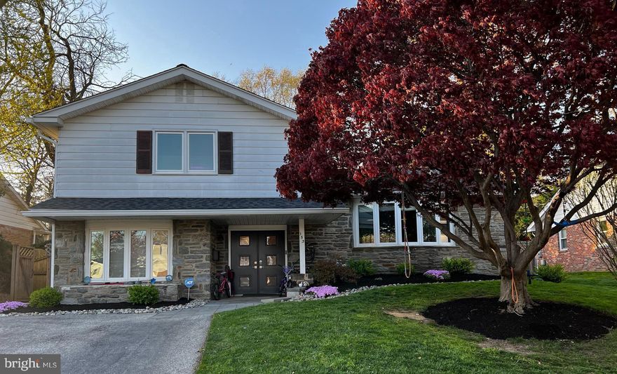 Welcome to your dream home.  Situated in a charming neighborhood on a cul-de-sac street, this 5 bedroom, 3.5 bath home embodies comfort and convenience at every turn.   Step through the covered front entrance through the magnificent new double doors.  Once inside you're greeted by a spacious foyer with an oversized custom designed closet.  On this entry level you will find a convenient first floor bedroom with a full bath.  Also on this level is a guest powder room, a large laundry room and a huge, versatile all purpose room.  Whether you need a home office, a hobby room, a play area for the kids, or a cozy den to unwind in, this adaptable space can be tailored to suit your lifestyle.  Ascend the stairs to the main living area of the home where you are greeted with a spacious living room featuring gleaming hardwood floors, a beautiful bow window and recessed lighting. This area transitions seamlessly into the dining room. creating  a cohesive space that's perfect for entertaining.  The natural light on this level is exceptional courtesy of the newly installed sun tunnels that illuminates the entire area.   Off the dining room is the eat-in kitchen with granite countertops, tile backsplash,  gas cooktop, double ovens, 2 sinks and two dishwashers and a wonderful eating area that overlooks the backyard.   Upstairs you will find the owners retreat with a custom designed walk-in closet and an ensuite bath featuring double vanities and a stall shower.  There are 3 additional generously sized bedrooms on this level each with custom closet organization, there is also a hall bathroom with tub/shower combination and an oversized linen closet.  Finally, the fully finished basement offers storage area and even more living space for home office or a comfortable family hang out room.  The exterior of the home has been wonderfully updated to include new landscaping with improved drainage, sprinkler system, paved walkway, maintenance free deck, and new patio.  Additional upgrades to the home include new ceilings and recessed lighting throughout, smart light switches, new central air conditioning, complete roof replacement to include insulation and venting of all bathroom exhaust fans.  This home has been lovingly updated and cared for by its current owner.  This home offers everything you need for modern living in an excellent location in the top rated Lower Merion School District and its easy access to highways, trains and shopping makes this home a MUST SEE.