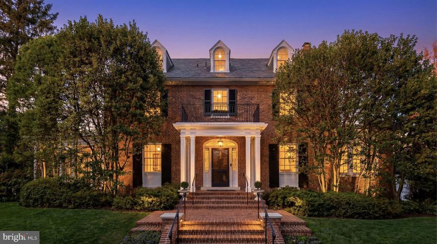 Set along one of Observatory Circle’s most sought-after streets, 3609 Edmunds Street NW is an exceptional red brick Colonial offering timeless architecture and refined living. Prominently situated on a rare and expansive double lot totaling 0.29 acres, a true scarcity in this highly coveted neighborhood, the home is framed by mature landscaping and an expertly maintained yard that conveys a sense of composure and serene privacy. Its classically proportioned exterior is approached by a central brick walkway leading to a columned portico, centered beneath three charming dormers.

The front door opens to a classic center hall floor plan showcasing gleaming, refinished dark hardwood floors. Flanking the foyer are formal living and dining rooms. The living room spans the full depth of the home and is anchored by a fireplace, highlighted by a bay window with built-ins overlooking the lush rear grounds. Two sets of French doors open seamlessly to the sunroom, while multiple sliding glass doors connect to a private brick patio, creating an effortless indoor-outdoor flow.

The dining room is intimate yet spacious and features French doors opening to a well-appointed study, an ideal post-dinner retreat. The kitchen introduces a contemporary counterpoint with sleek European-style cabinetry, granite countertops, and a full suite of high-end stainless steel appliances. It flows naturally into a bright breakfast nook, and a powder room completes the main level.

Upstairs, the expansive primary suite serves as a private sanctuary, with two walk-in closets and a light-filled dressing room with a dedicated makeup vanity. The en-suite bath is elegantly appointed with dual vanities and a skylit shower-tub combination. Two additional bedrooms share a hall bath finished in Carrara marble with a contrasting vanity and warm metallic fixtures. The top level offers two additional bedrooms, a cedar closet, ample storage, and a full bath featuring a classic cast iron tub and shower.

The lower level is designed for both relaxation and entertaining, centered around a generous recreation room with concealed storage. A bonus room, powder room, and laundry area complete the space.

Outdoors, the parklike grounds provide a private and inviting environment, enhanced by the scale of the double lot. A freeform swimming pool is surrounded by flagstone hardscaping, creating a natural focal point for outdoor living. The charming bi-level pool house, finished in a lodge-inspired style with rich wood paneling, stacked stone, and slate tile, offers additional living and entertaining space, including a full bath on the upper level. Throughout the property, curated gardens, tucked-away seating areas, and a pergola contribute to a quiet sense of seclusion.

The landscape reflects years of thoughtful stewardship, with mature, old-growth plantings forming a natural canopy that enhances both beauty and privacy. As a corner lot with only one immediate neighbor, the setting offers a rare degree of exclusivity. The grounds were thoughtfully redesigned and recognized as an award-winning landscape by Southern Living, further underscoring the property’s distinction.

Blending impressive scale with refined finishes in a historically significant setting, 3609 Edmunds Street NW represents a rare opportunity in one of Washington’s most distinguished neighborhoods.