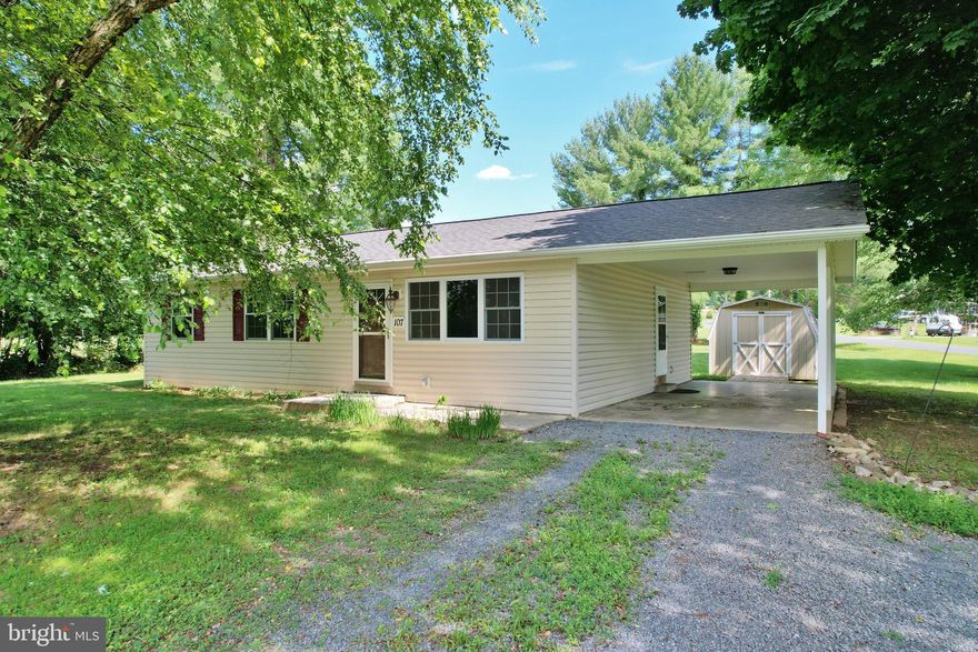 This is a lovely ranch home on nice level lot with beautiful views of the Massanutten mountain. Property includes concrete carport, detached outbuilding and mature trees.  Main level has three bedrooms, two full baths, hardwood floors, efficient kitchen with a gas range.  Lower level has a super large entertainment room, bonus room, and a wonderful storage area.  Property has been freshly painted and is ready for your summertime fun. Don’t miss your opportunity to see this property at 107 Crisman Road Edinburg, Virginia.  Call for your tour today!