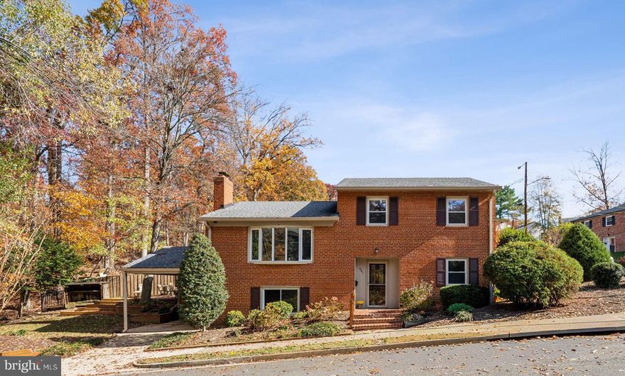 Welcome to 641 S Greenbrier Street — a classic all-brick mid-century modern gem in the sought-after Forest Glen neighborhood!

This beautifully maintained four-level split home offers the perfect blend of character, comfort, and convenience — ideally situated at the end of a quiet street with direct park access.

Featuring five true bedrooms, this home provides flexible spaces to gather, entertain, work, or simply unwind. Inside, you’ll find a thoughtfully updated kitchen with an eat-in bar, gas cooktop for the serious chef, custom pantry storage, Corian countertops, stainless steel appliances, plenty of cabinet storage and seamless connections to both the dining and living rooms. The bright, spacious living room features hardwood floors, a handsome brick wood-burning fireplace, and a large bay window that floods the space with natural light.  From the dining room, step outside to multiple deck and patio areas, surrounded by mature landscaping and tall trees — the perfect setting for outdoor living and entertaining.  Upstairs, the hardwood floors continue into the primary suite and two additional bedrooms. The primary bedroom includes a convenient en-suite half bath. The shared hall bath has brand new frameless shower door, tile floors, Corian surfaces, storage,  recessed lighting and a wonderful a skylight.  The entry level features a welcoming foyer with a large closets, two generous bedrooms, and another nice full bath — along with stunning custom interior doors.  On the lower level, a cozy den with fireplace, large window, and abundant built-in storage and bookcases creates an inviting retreat. The laundry/workshop area includes direct access to the covered carport with space for one vehicle.

The lush, landscaped grounds include flowering shrubs, decks, patios, and a rain barrel — all nestled beside the park’s green space. Lockable storage shed on carport and open shed in back for firewood. Outdoor furniture & rain barrel convey! Plus the lawnmower is in the locked shed, it's yours too, if you wish!

Nature lovers will appreciate the unbeatable location: the Glencarlyn Dog Park, Long Branch Nature Center, Four Mile Run Trail, and W&OD Trail all connect directly beside the home. Commuters enjoy quick access to ART and Metrobus stops, plus short trips to shopping, dining, and entertainment. With close proximity to DC, Metro, the airport, museums, and historic sites, this is one of South Arlington’s most vibrant and convenient locations.

Lovingly maintained by the same owners since 1992. Major updates include: Roof (2017) HVAC (2016)
Kitchen remodel (2020) Bath, paint, carpet and lighting updates (2025) See the Special Features & Systems Info document in the Agent section for full details.

Don’t miss this Forest Glen treasure!