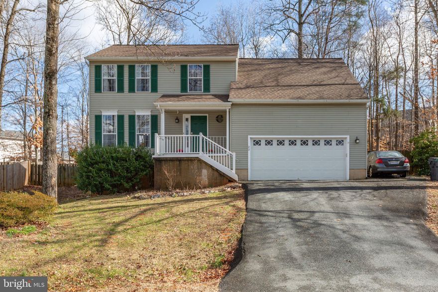 Showings to start Friday 2/16
Welcome to 22 Parkwood Court in the  Meadowood Park neighborhood of North Stafford.  Located at the end of the cul-de-sac, this 4 bedroom 2 full/2 half bath has been thoughtfully updated and is move-in ready.  With three finished levels, there is plenty of room for everyone to stretch out.
 A formal living room (currently used as an office/study room) flows into a bright formal dining room.  The dining room is large enough to accommodate a six-person table plus.  Continue into the updated kitchen with lovely white cabinets, updated appliances and granite counters.  With an extended peninsula that seats four, entertaining or everyday meals are a breeze.  The main family room is roomy enough for a huge sectional, but stays cozy thanks to the wood-burning  fireplace.  A sliding door (2022) allows access to the large deck with steps to the fully fenced back yard which is perfect for both entertaining friends and family ( the trampoline will convey) or a lazy afternoon in the hammock. The attached two car garage has overhead storage racks and a convenient EV wall charger that will convey.
Next, head upstairs to find the home's four bedrooms.   The primary bedroom overlooks the backyard and features an ensuite and walk in closet.   The hall bath has been refreshed and is shared by the remaining bedrooms.   Bedroom four is HUGE could be repurposed as a great study/playroom.   If you still need more space don't miss the basement.  The current owners have done an amazing makeover to the lower level keeping both form and function in mind.  By redefining the space into A family/ rec room, office/storage area,  and a Not-to-code bedroom area, the basement is now perfect for multi-generational living or an extended guest suite.   The laundry room has also been finished off and a second half bath rounds out this level.  If you have been searching for a home with a blend of quality updates, spacious rooms,  a convenient North Stafford location, and a lot that affords fully-fenced privacy, don't miss 22 Parkwood Court.

** Owners have made over $40,000 in upgrades since purchasing the home***  Roof and gutters 2017, 4 ton Rheem Heat pump 2015, Water heater 2016.

Join us for Open Houses this weekend, Saturday 2/17 12-3 pm and Sunday 12-3 pm.  Agents, you agency relationship is always respected, so don't hesitate to send your clients.